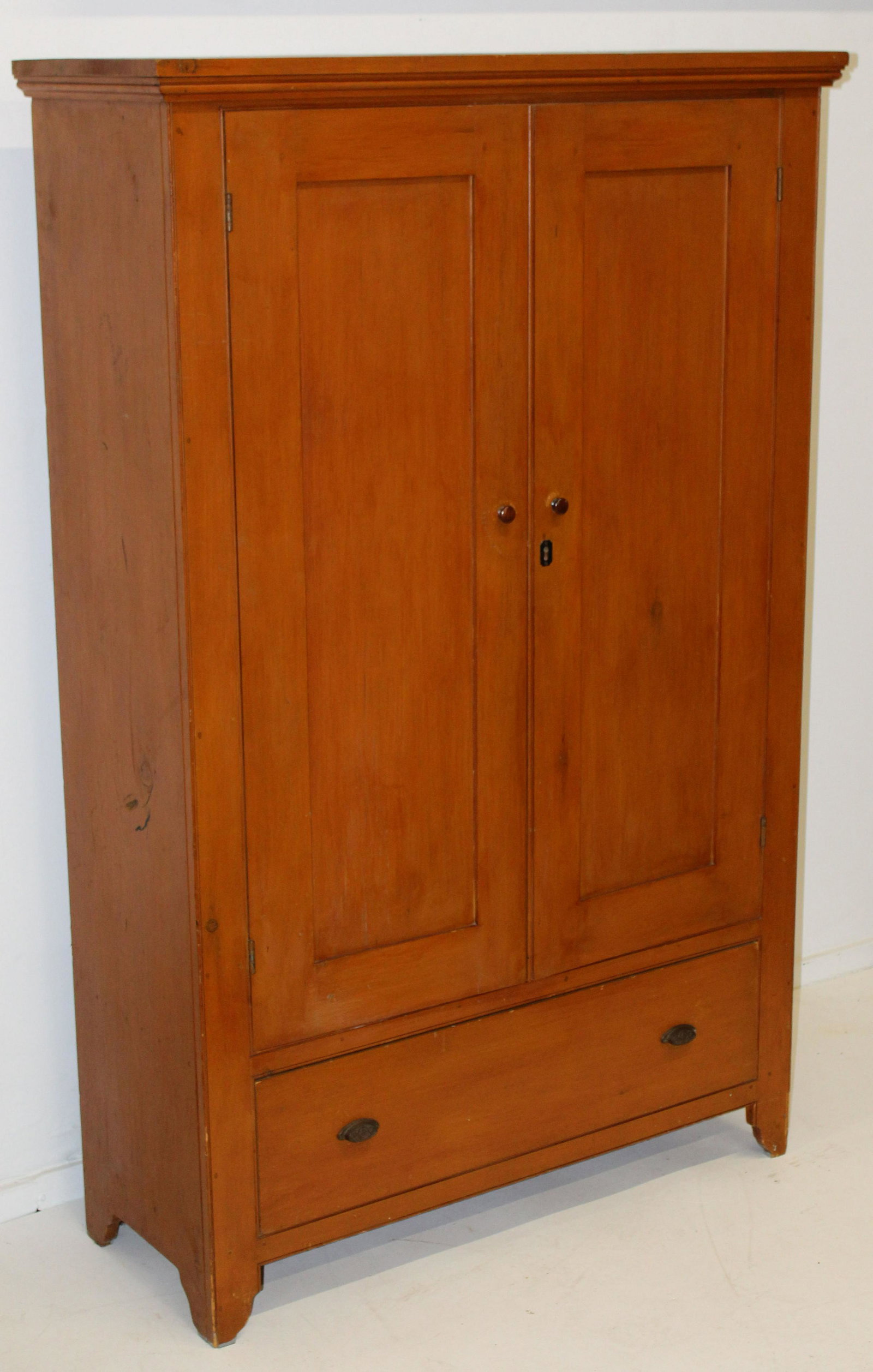 Salmon painted 19th c two door cupboard.: Shaker like 19th c two door cupboard with lower drawer. Original salmon paint. Replaced back boards, and lower drawer with metal Victorian pulls. 45" x 17" x 73" h. White pine, beaded moldings, excell