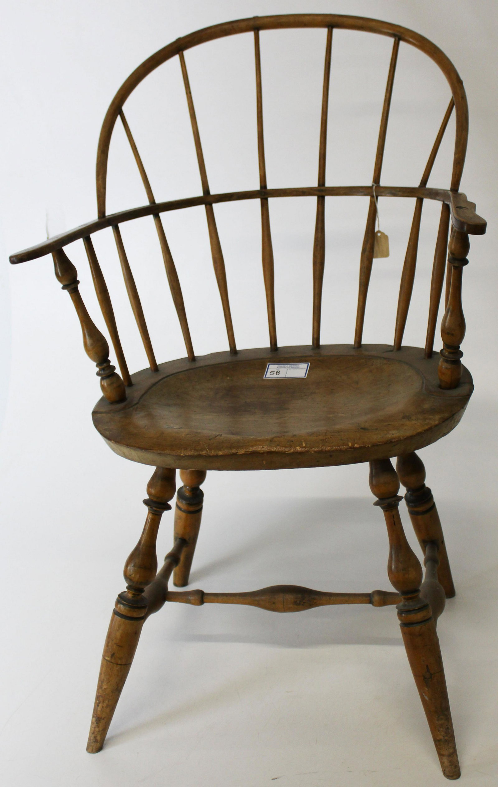 18th c Sack back Windsor arm chair: Fine 18th c New England sack back Windsor arm chair. Bulbous turnings, H stretcher, saddle seat, refinished. Overall good condition.
