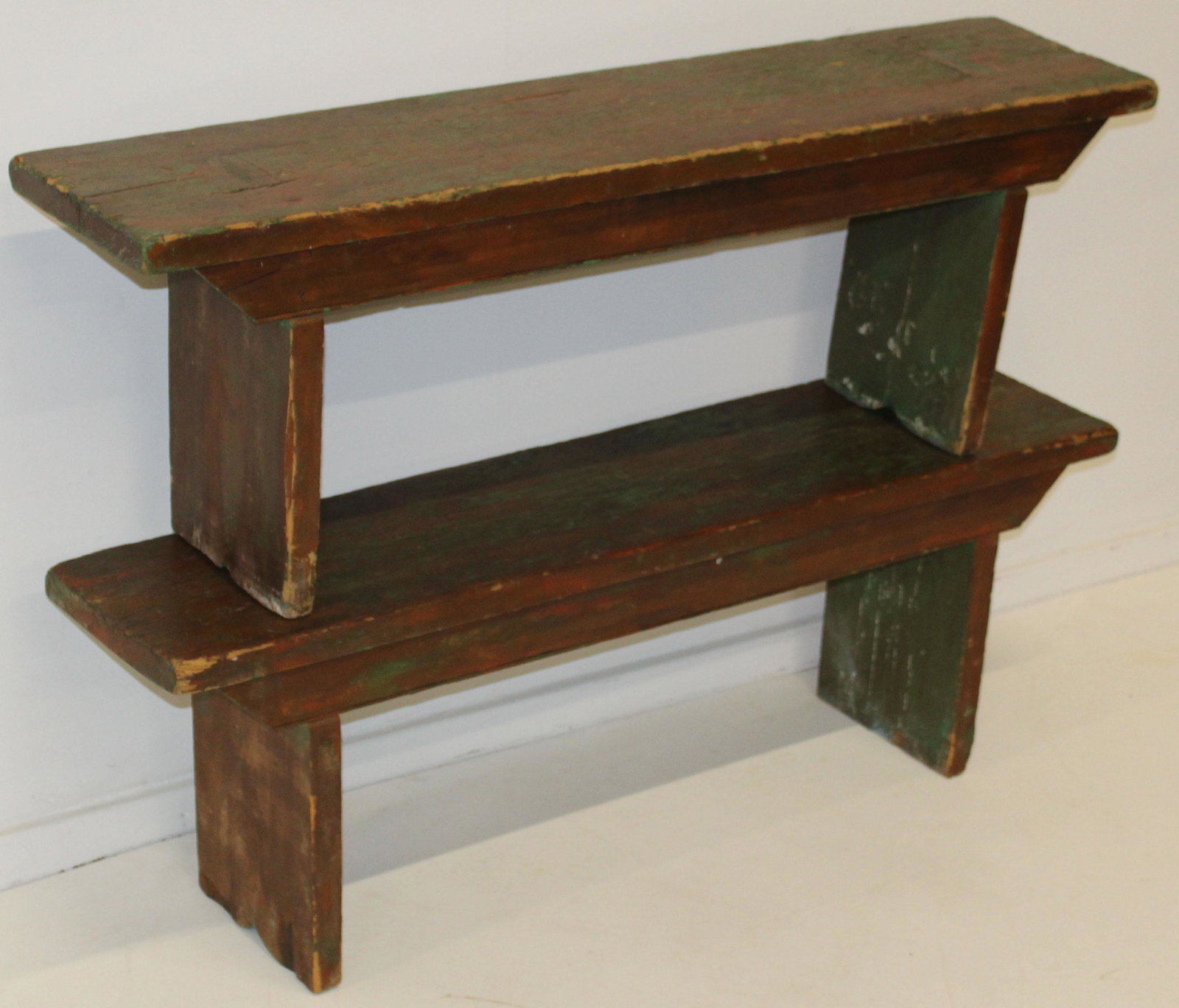 Pair of primitive benches: Pair of ca. 1900 benches in worn green and red paint. 48" long each.