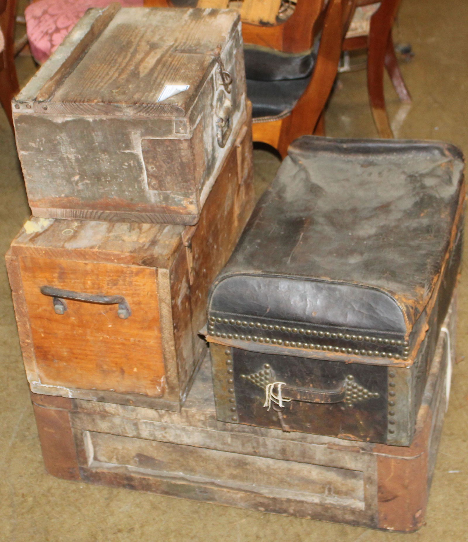 4 early wooden boxes: lot of 4 early wooden boxes including leather trunk with brass tack embellishments, old transport crates with tin reinforcements