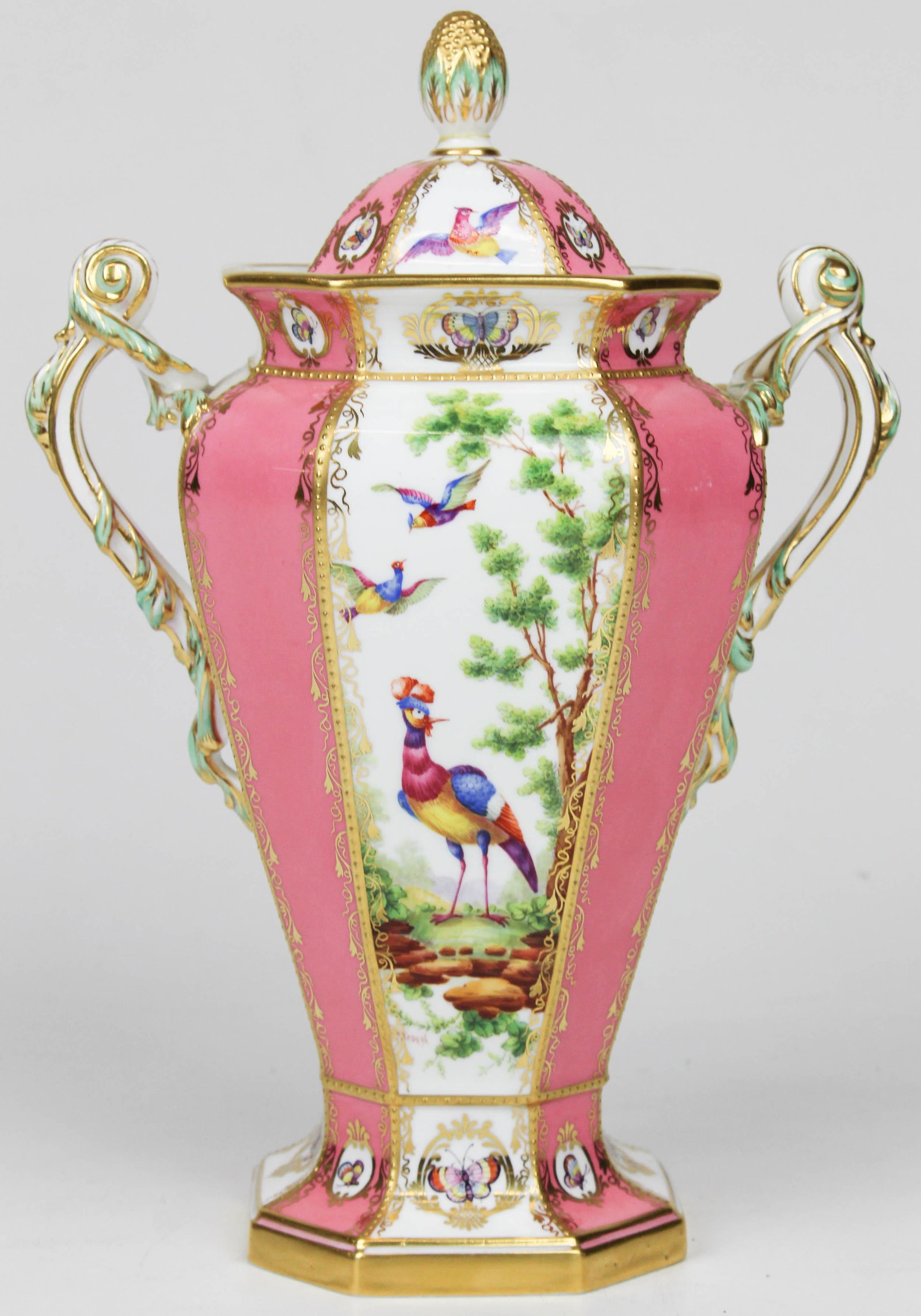 Copeland Spode porcelain garniture urn: Fine Copeland Spode porcelain covered garniture urn with hand painted scenic panels featuring exotic birds and landscapes, cartouches of butterflies and delicate gilt enamel accents 12" x 7.5" -knob t