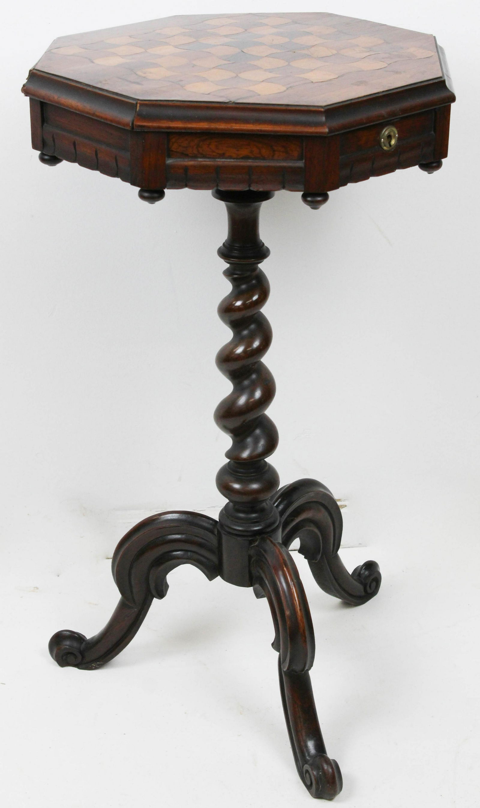 Victorian Inlaid Octagonal Lift Top Game Table: Fine mid-Victorian rosewood game table with finely inlaid checkerboard octagonal lift top revealing locking storage compartment, having drop finials and crenellated skirt, on tapered barley twist colu