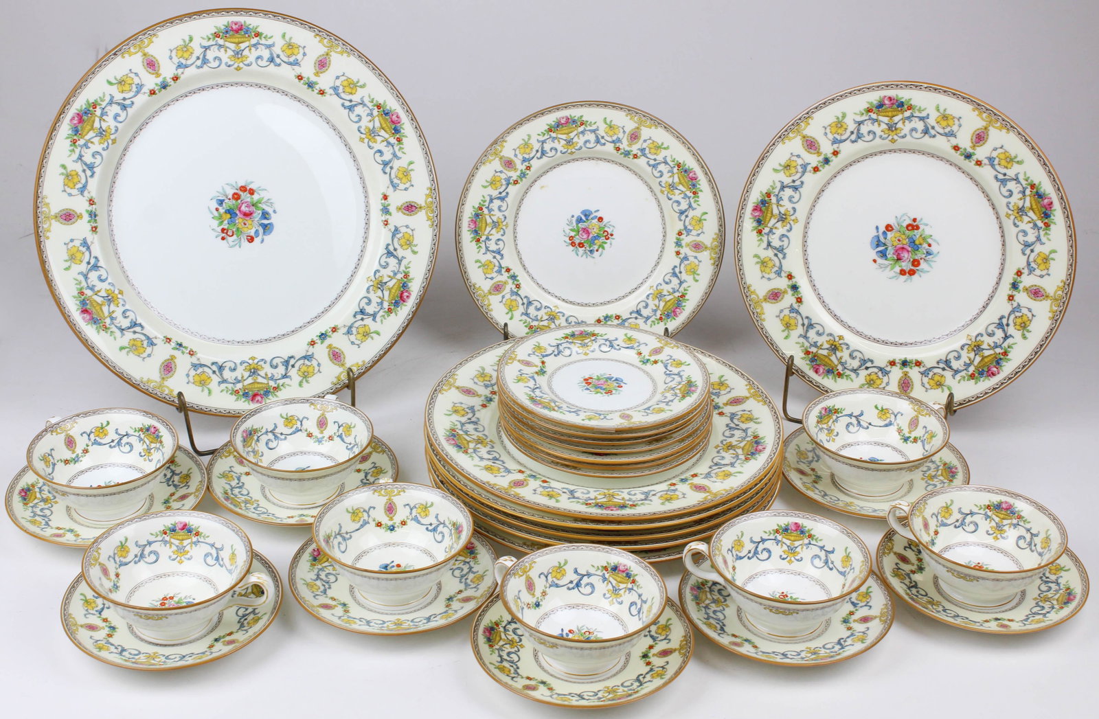 23 pcs. Minton Talbot Porcelain Dinnerware: 23 pcs. Minton "Talbot" pattern English bone china porcelain dinnerware consisting of 6 dinner plates, 7 side plates, 8 cups and saucers, small serving plate, large cake plate with polychrome neoclass
