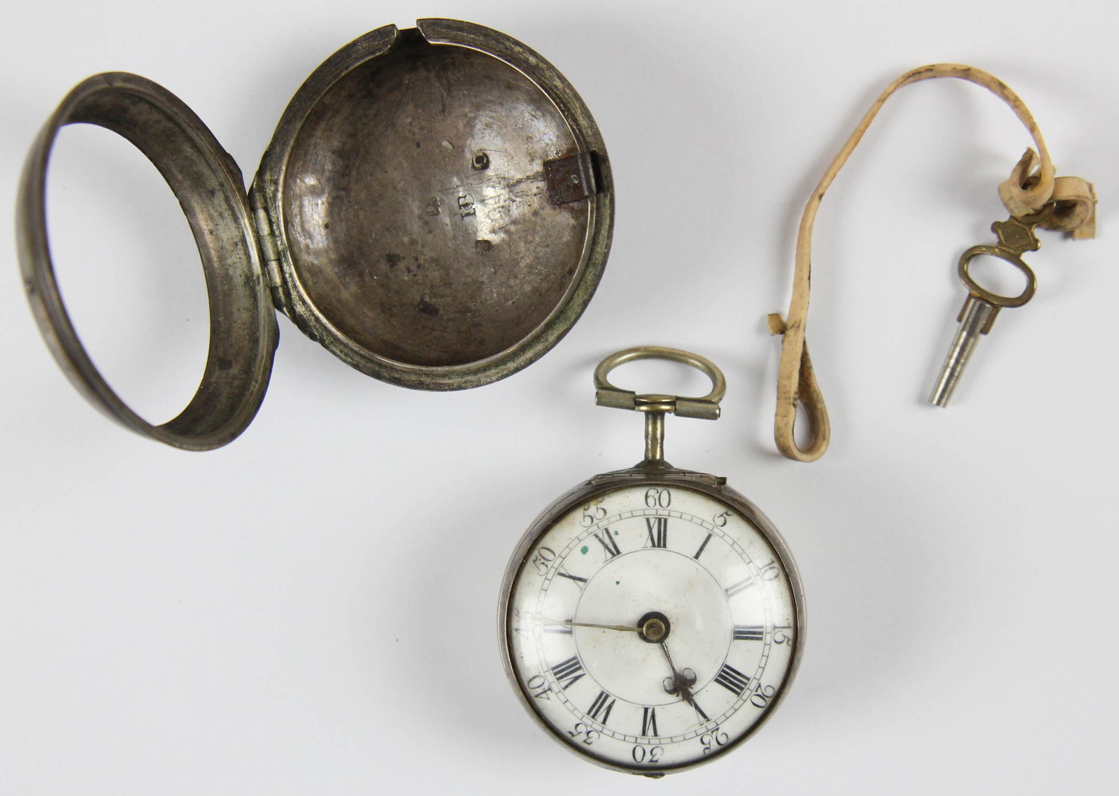 18th c London Dan Atkins coin silver pocket watch: 18th c London coin silver pocket watch Marked Dan (Daniel) Atkins London. Exterior coin silver case, interior coin case with enamel face, Roman numerals, Arabic numerical minutes, with key. Running.