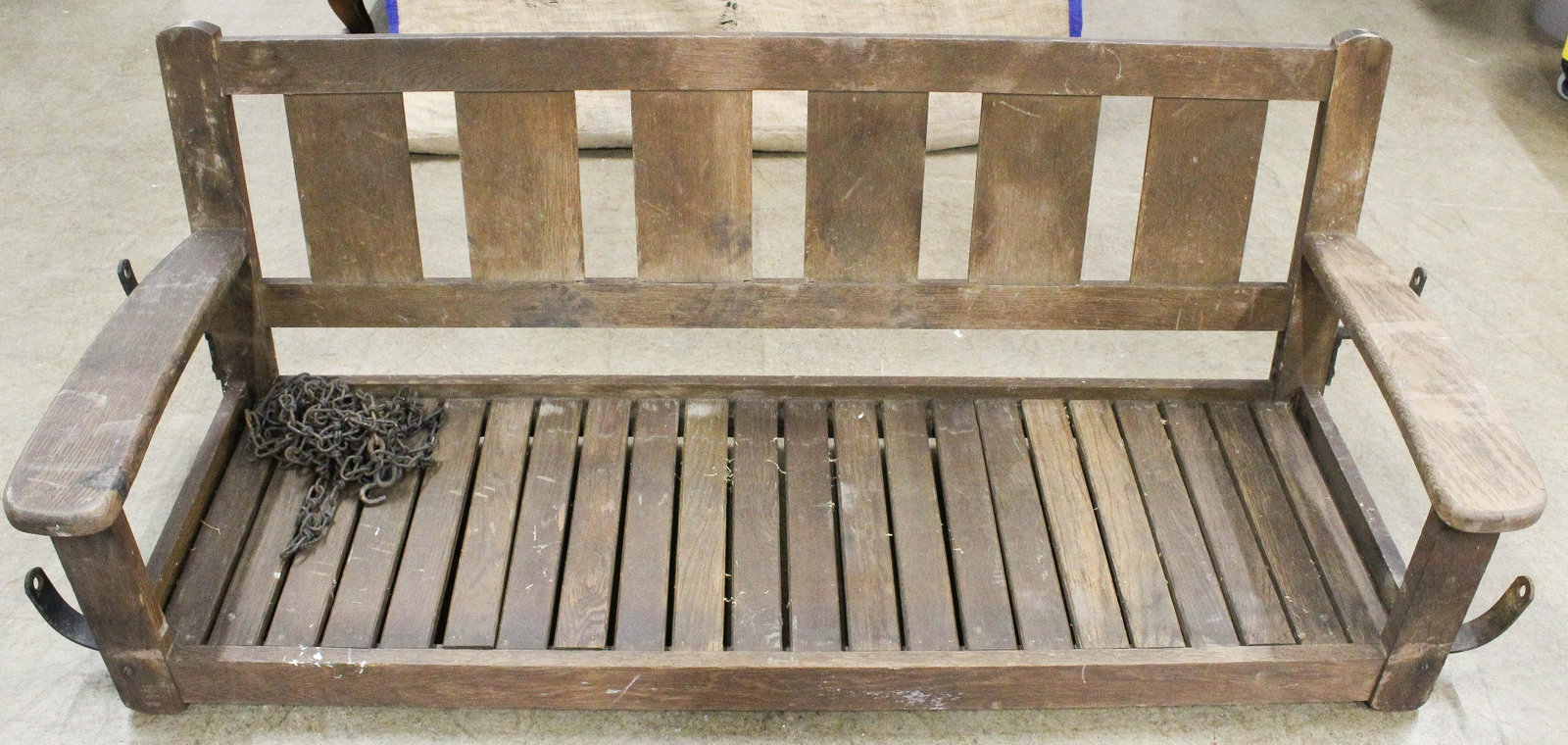 Mission Oak Slat Back Porch Swing Bench: ca. 1910 Arts and Crafts era mission oak slat back porch swing bench originally from the Adirondack Great Camp "Creyleyron" on Lake Placid, NY, in old dry finish with chains and iron hanging brackets 