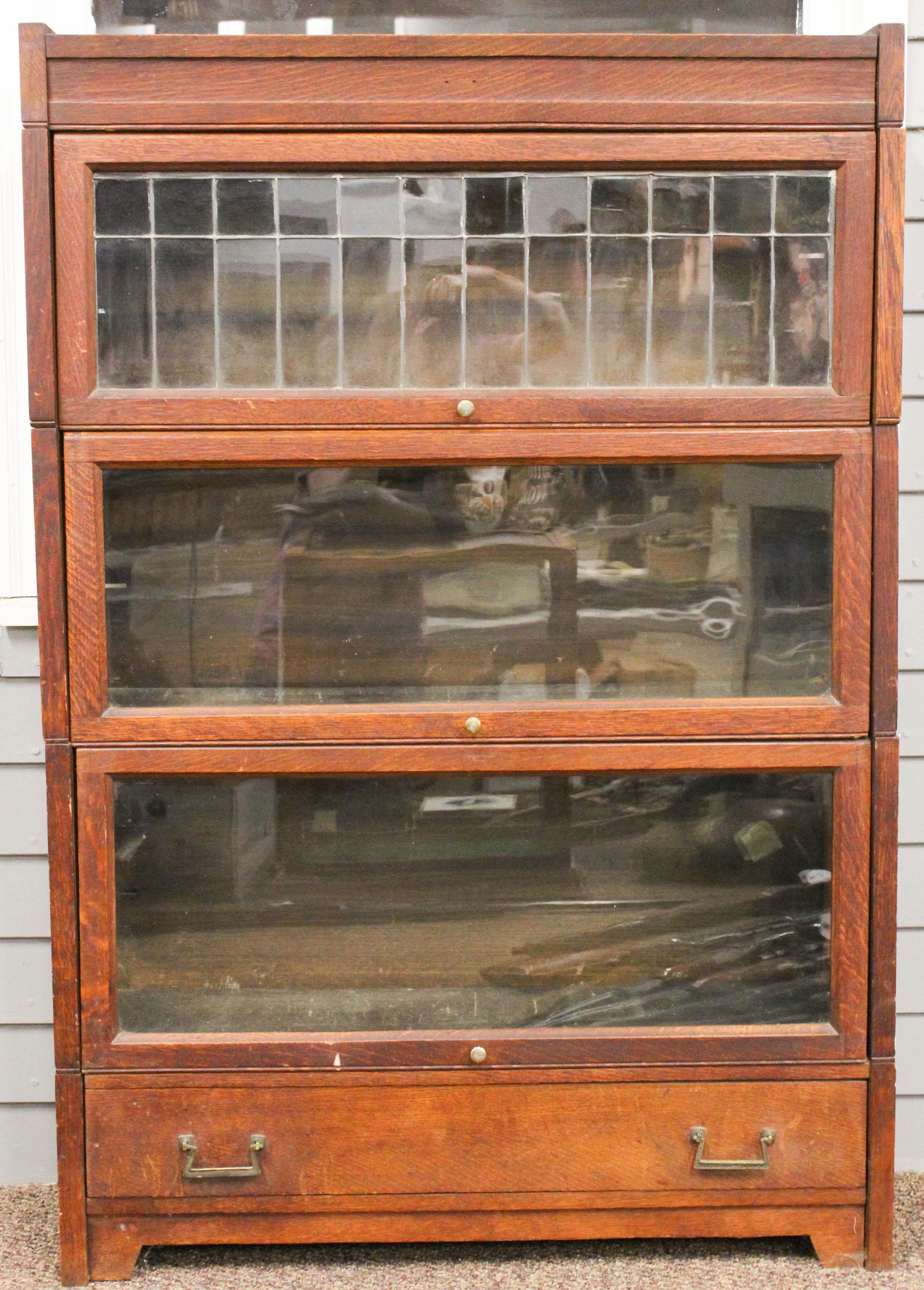 Lundstrom Arts and Crafts Oak Sectional Bookcase: Lundstrom Arts and Crafts Mission style oak 3 section stacking bookcase with upper section having leaded panel, base with drawer