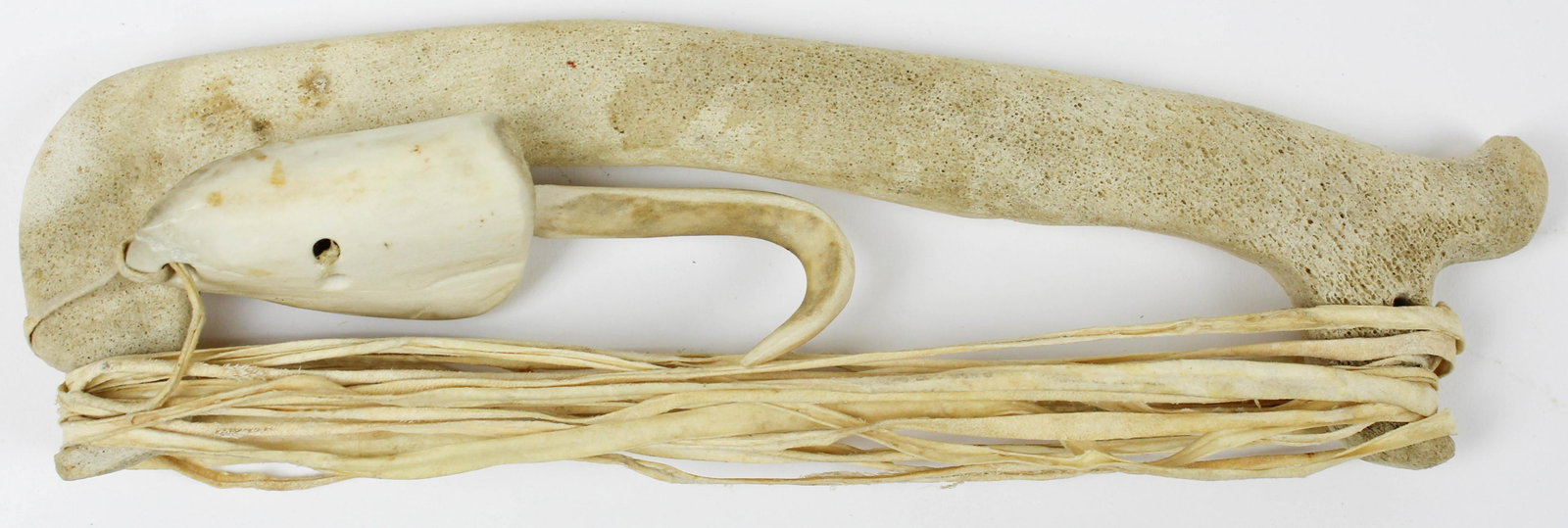 Inuit Carved Bone Fishing Rig: Inuit carved bone fishing hook, bone jig stick, & hide cordage, length