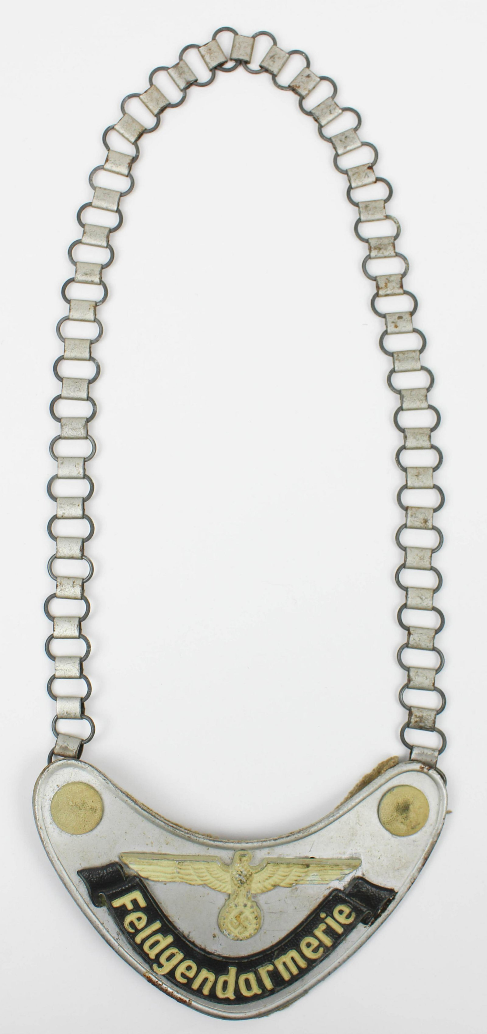 WWII Third Reich Feldgendarmerie Gorget: Early WWII German Third Reich Army/ SS military police Feldgendarmerie gorget, marked M enclosed by a square on diagonal, light grey wool cloth backing, magnetic steel plate, luminescent paint, with n