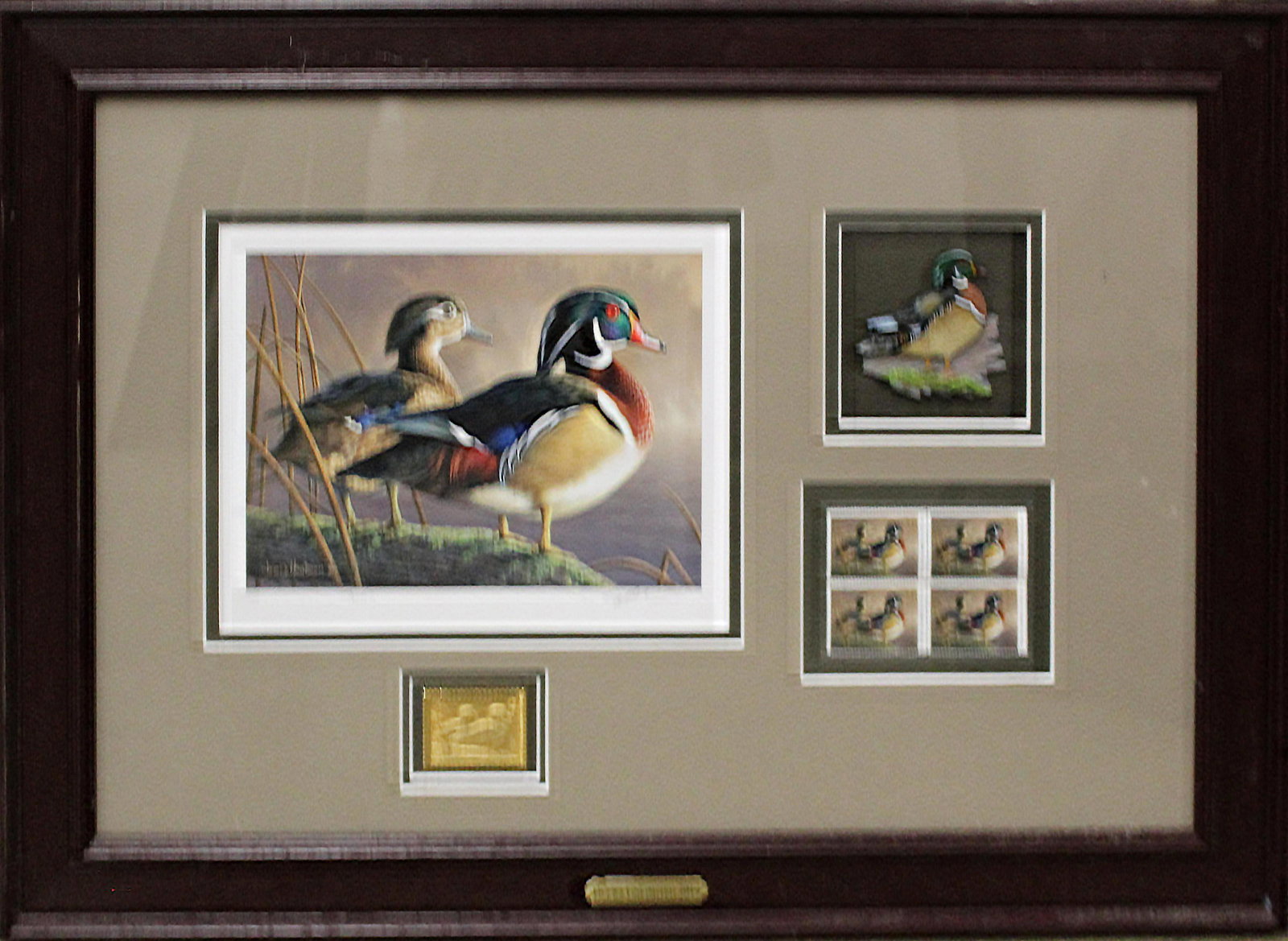Ducks Unlimited 2012 Waterfowl Stamp: Ducks Unlimited 2012 Waterfowl Stamp- Shadowboxed 2012 Waterfowl stamp with block of 4 $5 stamps, a gilt stamp, a signed James Hautman print and a painted wooden duck figure. Entire presentation measu