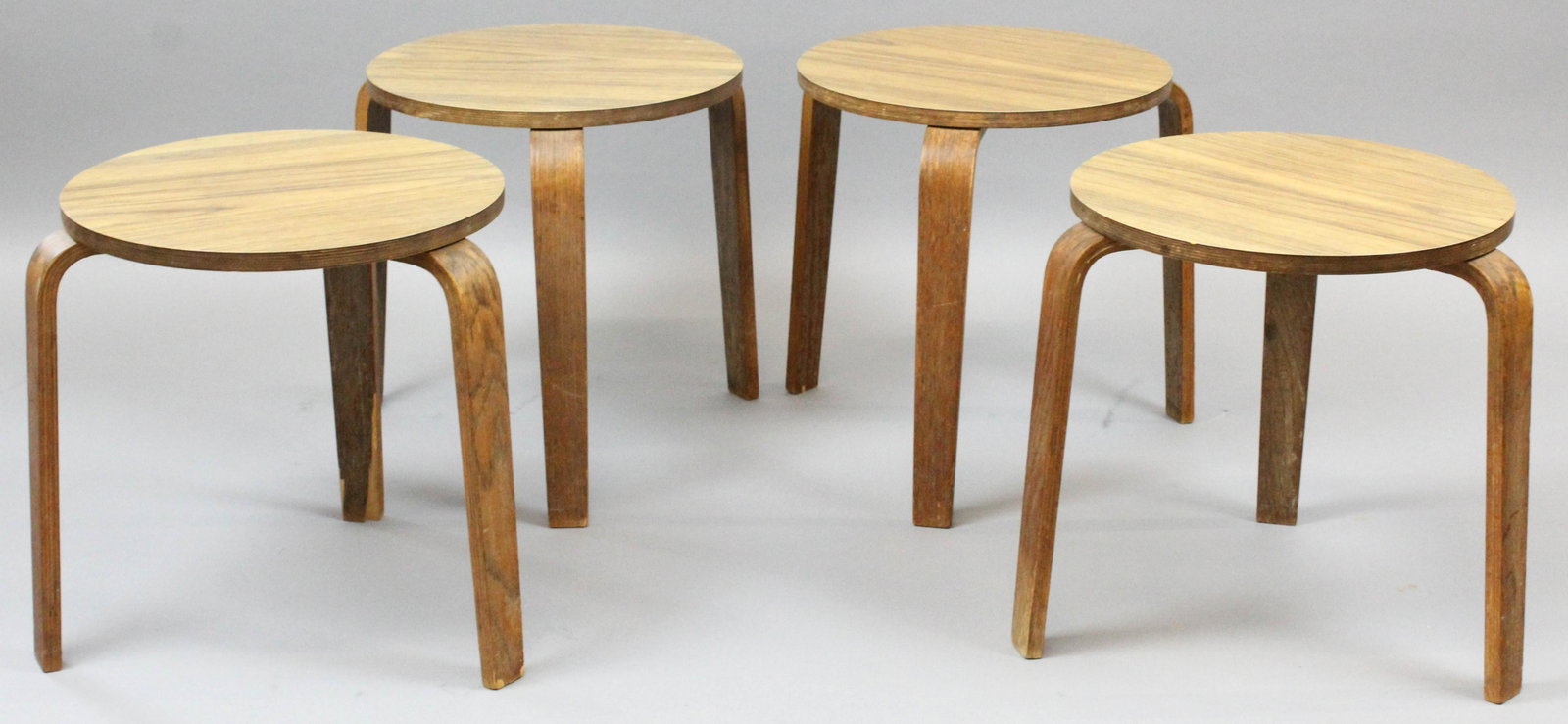 Set of 4 Alvar Alto Bentwood Stacking Stools: Set of 4 Mid Century Alvar Alto design bentwood stacking stools, ht 15 1/2", one with some veneer loss on lower leg