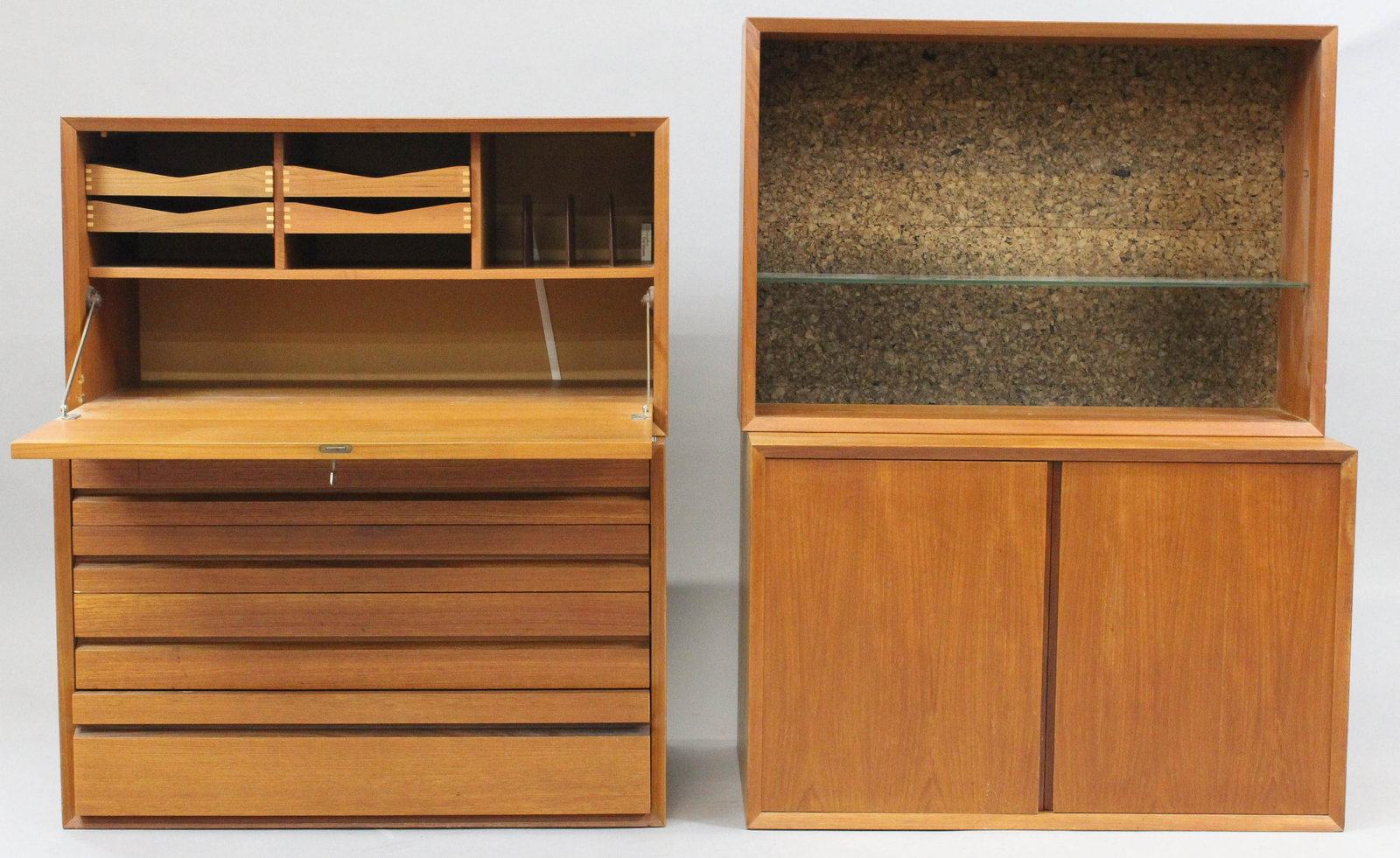 Cado Danish teak wall unit: The Cado system Danish teak wall system. Having 3 teak boxed sections one with drawers, a liqueur cabinet, and a double door cupboard. Many shelves and a long drawer. Some original boxes.