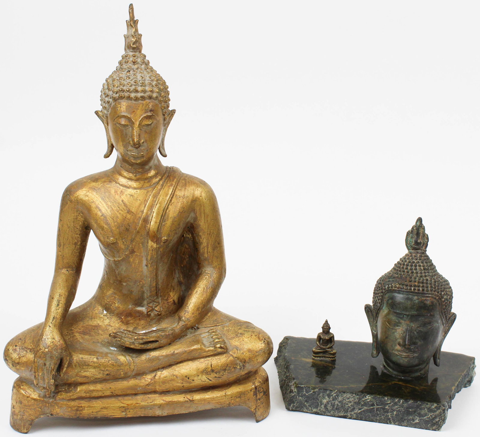 Buddha Cast Bronze Figures, Head: Buddha cast bronze figure, thin bronze with heavy clay interior, ht 11 3/4", sold with a cast Buddha head, ht 5", small cast bronze Buddha, ht 1 1/4"