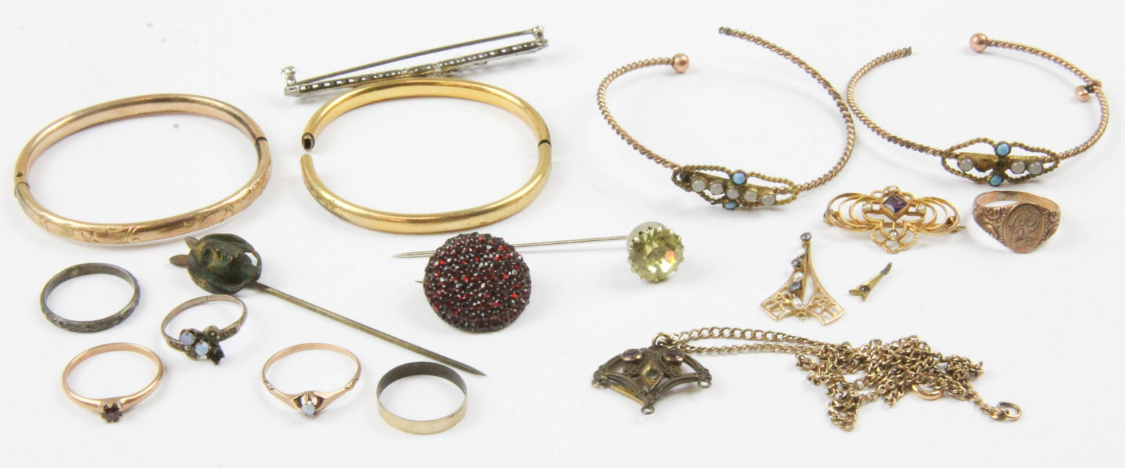 A group of Victorian era jewelry: A group of Victorian era jewelry including 1 10k y.g garnet & seed pearl pin, a 10 k y.g. seed pearl pendant, a round garnet pin, two stick pins one with native American portrait, several other Victor