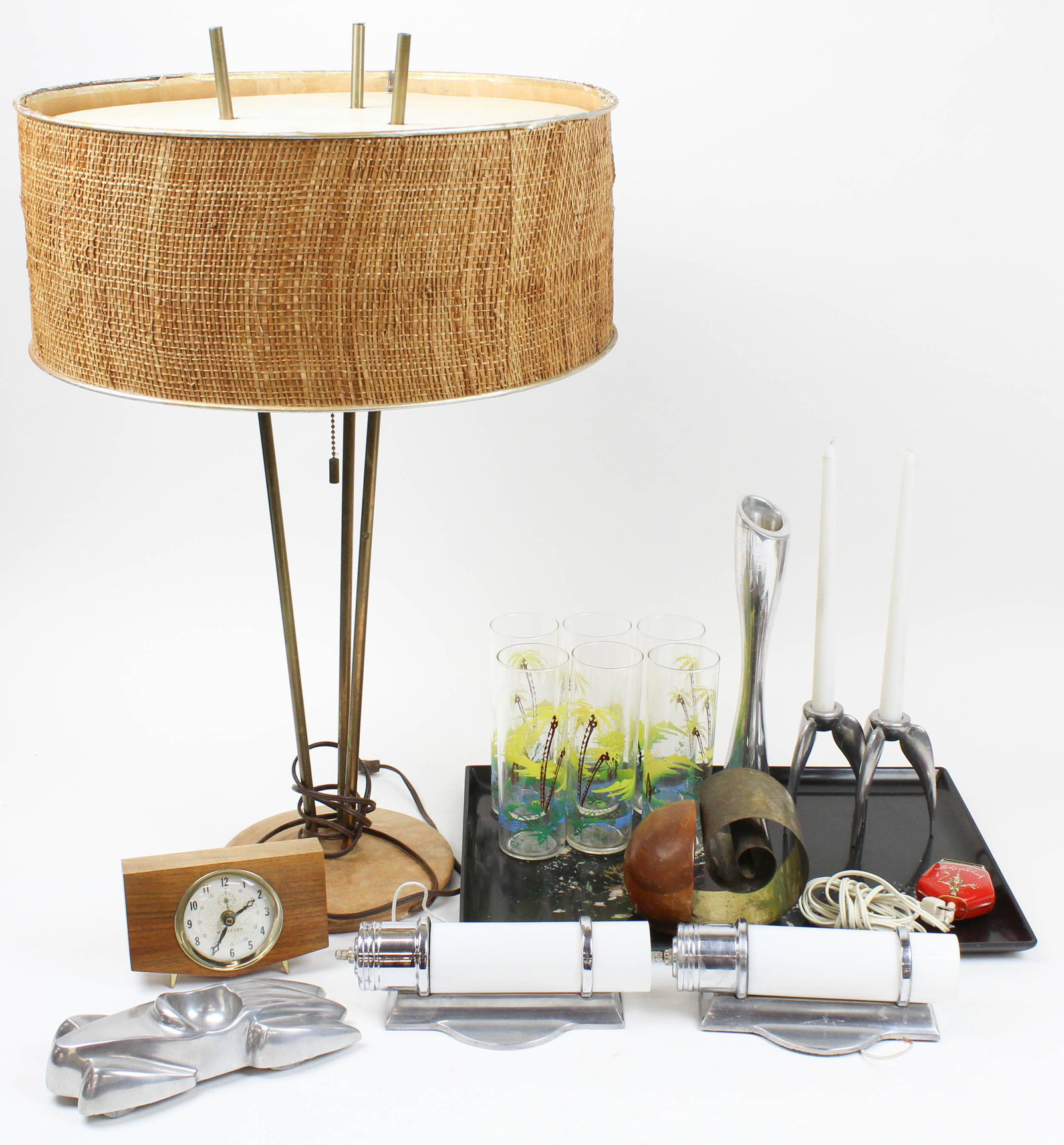 Lot of Mid Century Lighting, Barware, Accessories: Lot of Mid Century Lighting, Barware, and Accessories including Thurston type teak and brass tripod base table lamp with woven seagrass banded shade, pair of brushed aluminum Deco sconces with cylindr