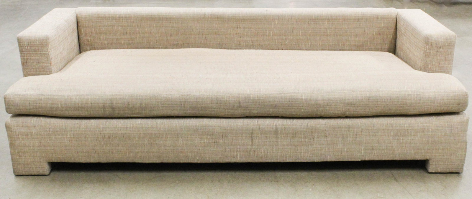 Modern sofa: A modern 7 foot long sofa / single bed. Tan woven fabric with 3 large back pillows 7 feet long