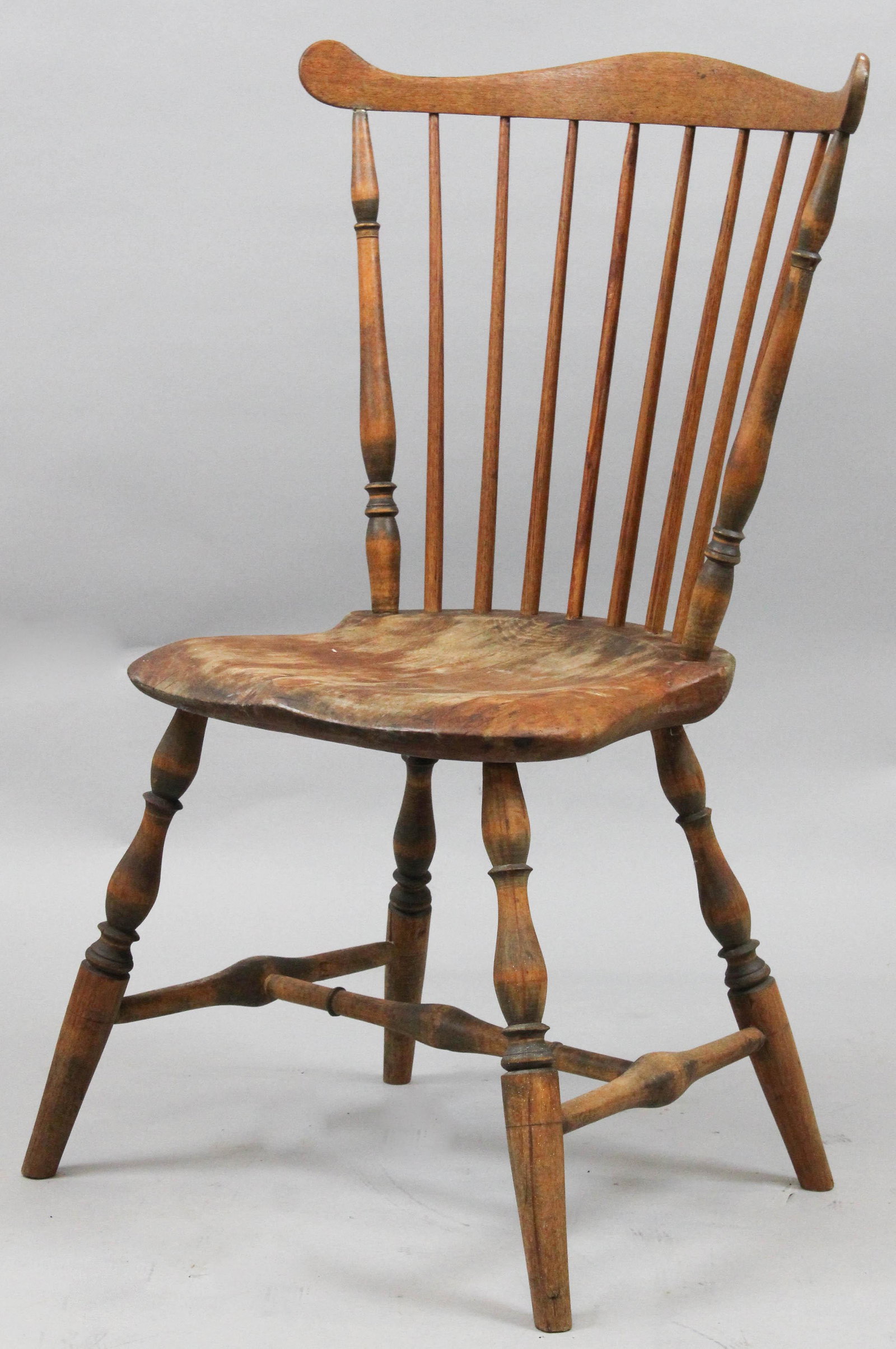18th c New England fan back Windsor chair: 18th c New England fan back Windsor side chair. Saddle seat, turned spindle back, H - stretcher base with turned legs. Pine, ash, & maple. Refinished.