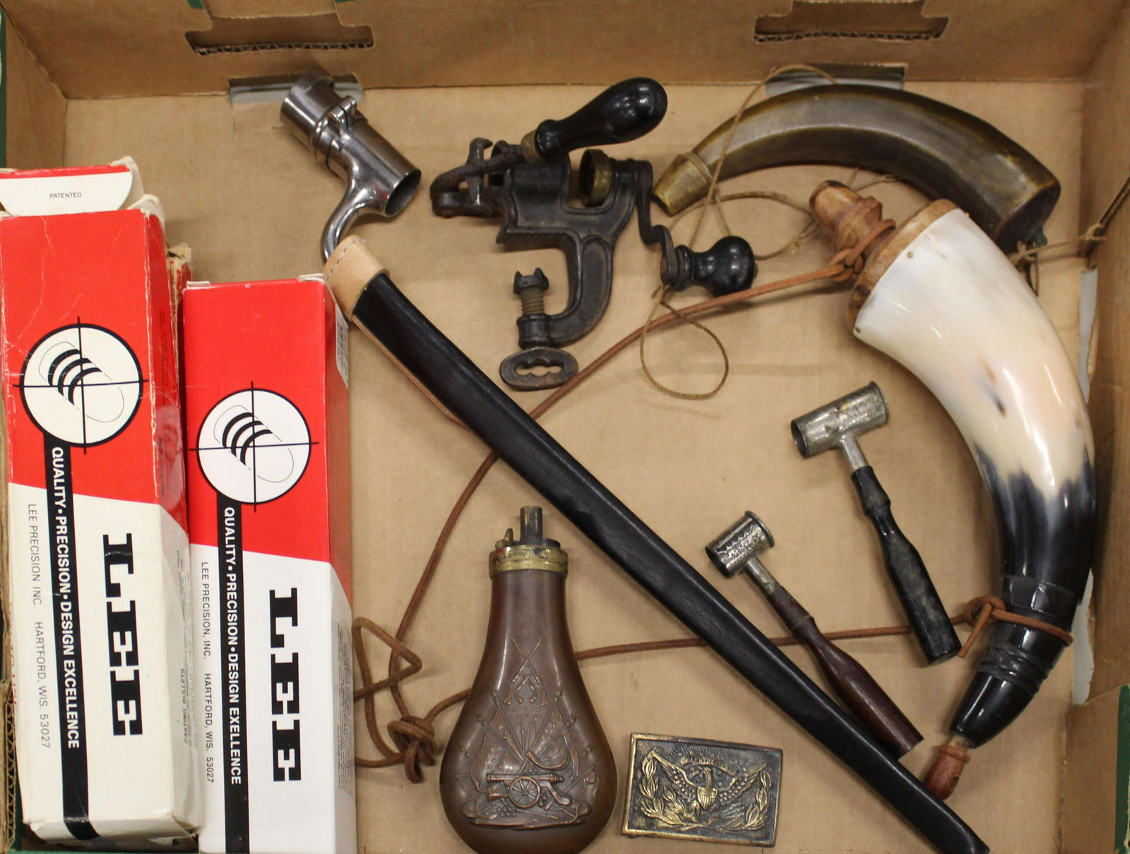 Sporting accessories: Lot including Period powder measures, old priming/pistol flask, newer powder horn, Colt's Patent flask marked Dixon and Son's England, Three Lee Loader Bullet molds in .454, .358, .457; 20th c Buckle;