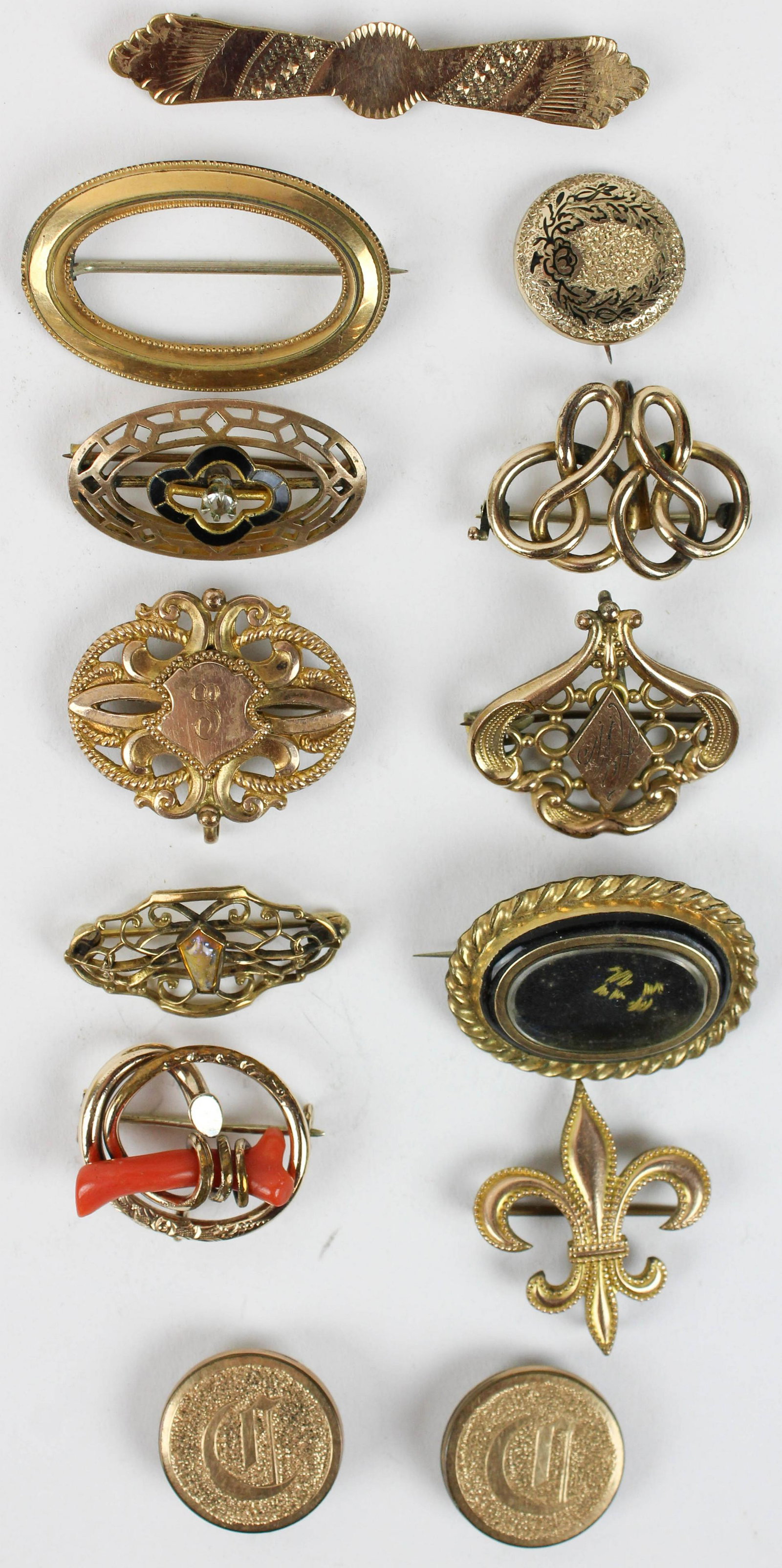 A group of 13 Victorian brooch pins: A group of 13 Victorian brooch pins and buttons including rolled gold, red coral, & hair locket.