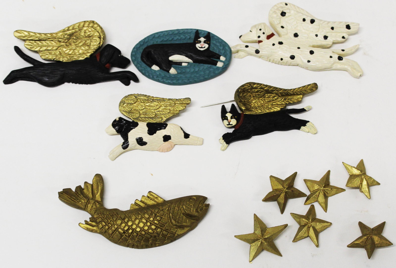 Stephen Huneck (VT 1948-2010) Collection of Pins: Seven Stephen Huneck (Vermont 1948-2010) Animal pins including cow, Cat, Fish, Dogs, and stars