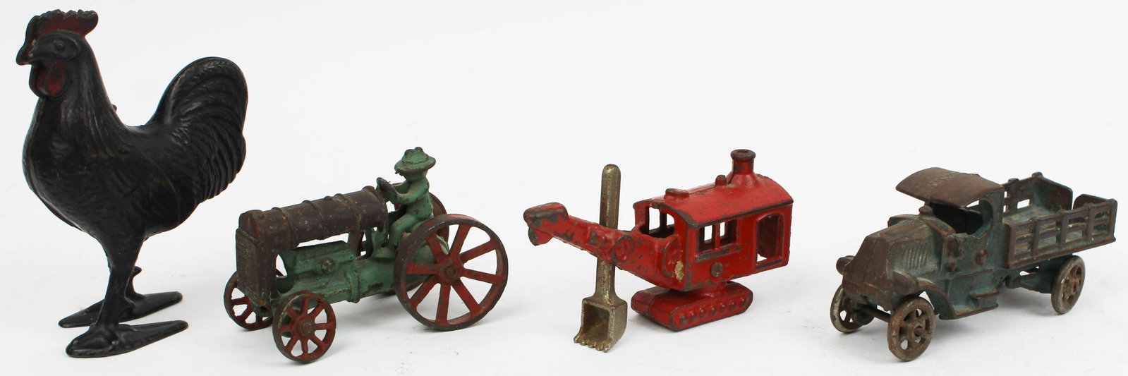 Early Cast Iron Toys and Rooster Bank: early cast iron A C Williams, steam shovel, A C Williams Mack stake truck, cast iron tractor, cast iron rooster still bank, lengths/ hts 4" to 5"
