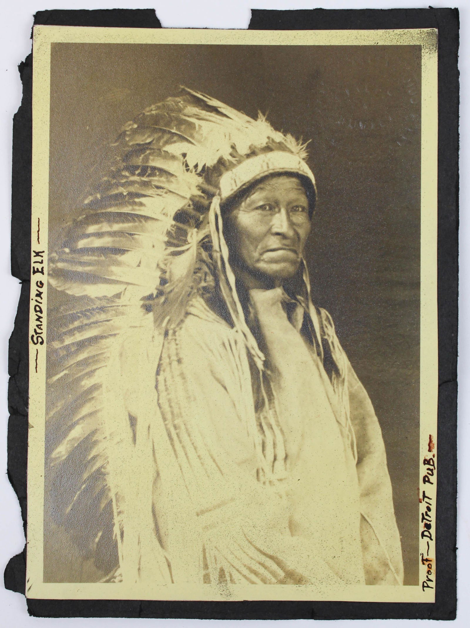 Carl Moon Photograph of Standing Elk: Carl Moon (1879- 1915) photograph of Standing Elk, notary seal on face of photo, marked Detroit Publishing Company Proof, paper size 7 1/4" x 5 1/4", glued onto a scrapbook page