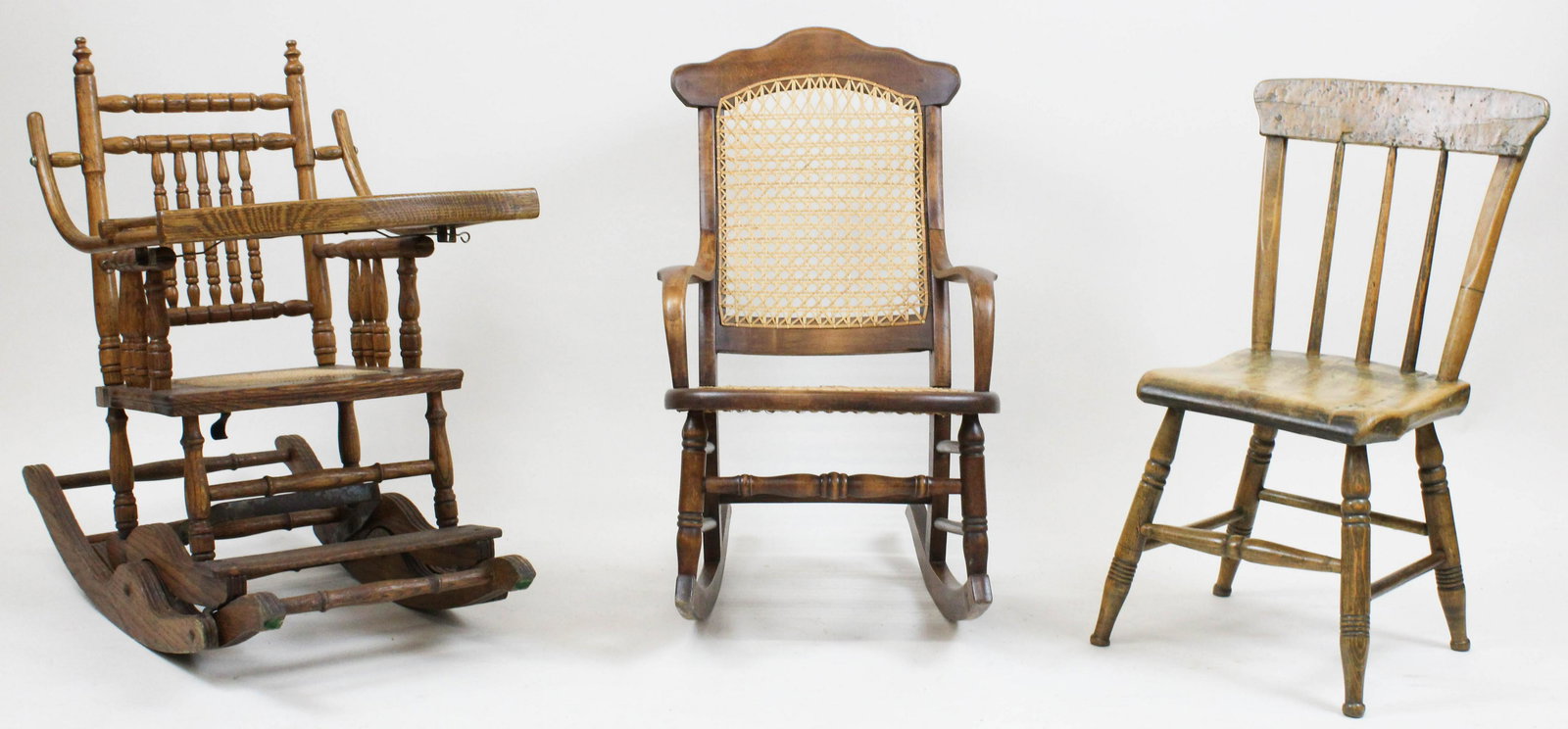 Group of 3 Antique Childs Chairs: Group of 3 Antique Childs Chairs including oak convertible child's high chair, Victorian walnut cane seat rocker, and refinished shovel seat side chair with curly maple top rail