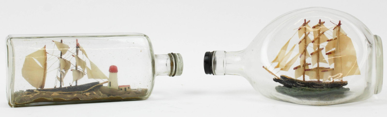 2 Vintage Ships In A Bottle: 2 vintage 1950's ships-in-a-bottle, overall lengths 8", 8 1/4"