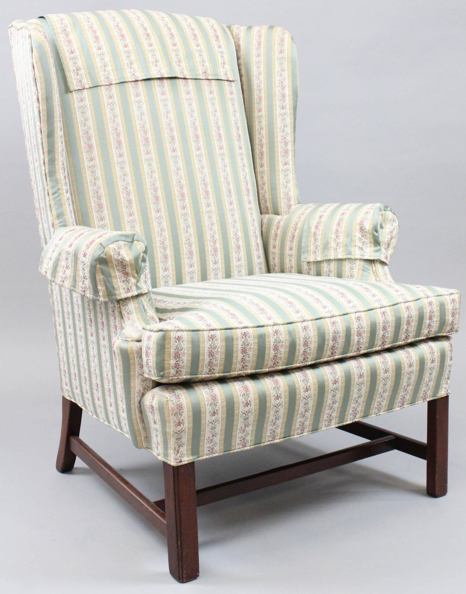 Green striped pattern Wingchair: 20th c Green and white striped wingchair with matching anti-mercassers in overall excellent condition.