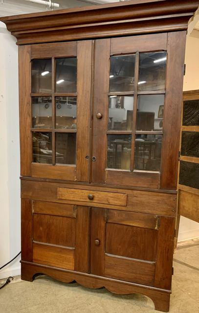 Ca. 1800 Roanoke VA walnut corner cupboard: Ca. 1800 Roanoke Virginia walnut corner cupboard. Cornice molding, double 6 glazed panel doors, single drawer, over double flat panel doors and bracket base. Dry old surface. 79" high.46" wide.