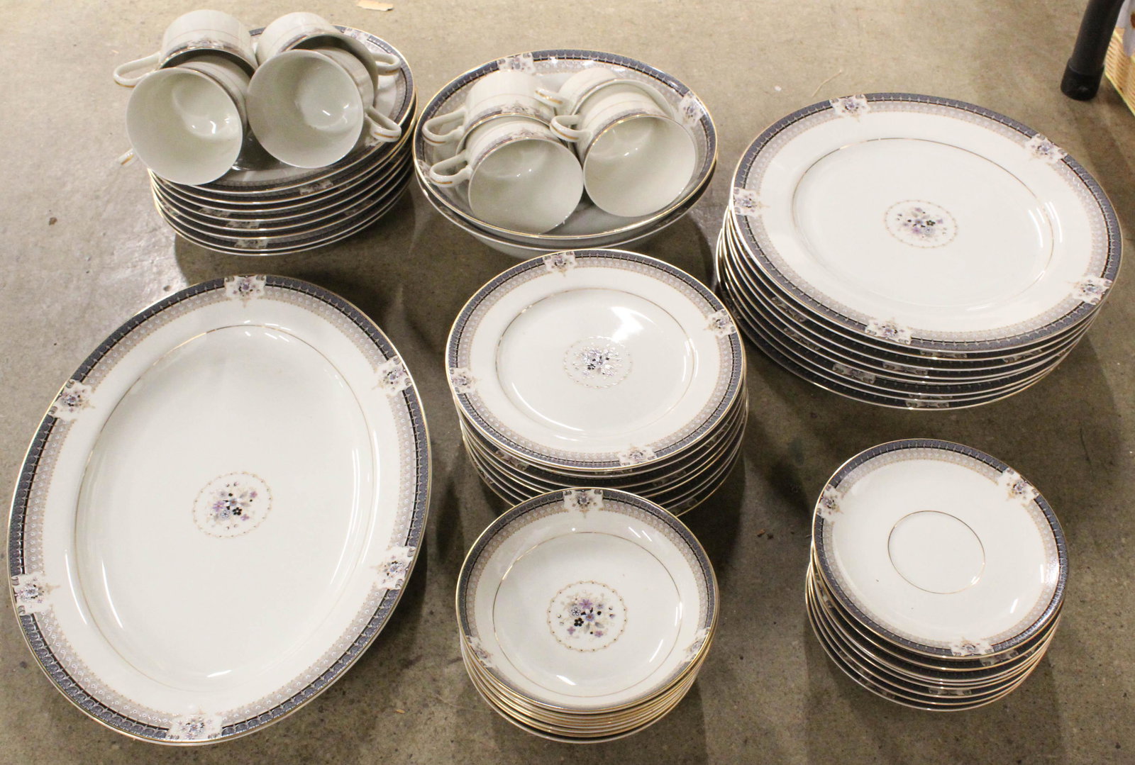 51 pcs. Mikasa Tropez Porcelain Dinnerware: 51 pcs. Mikasa "Tropez" Pattern Grande Ivory Porcelain Dinnerware, including dinner plates, cups and saucers, serving dishes, side bowls and plates, etc. approximately a service for 8