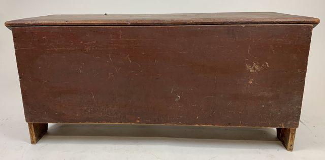 1803 red painted lift top chest: 1803 boot jack end blanket chest in original red paint signed on back and bottom in red paint "Lovey Clark Chris March 23, 1803 Made by James Tuttle Jr & Co" 42" l, 20" h, 15" d.