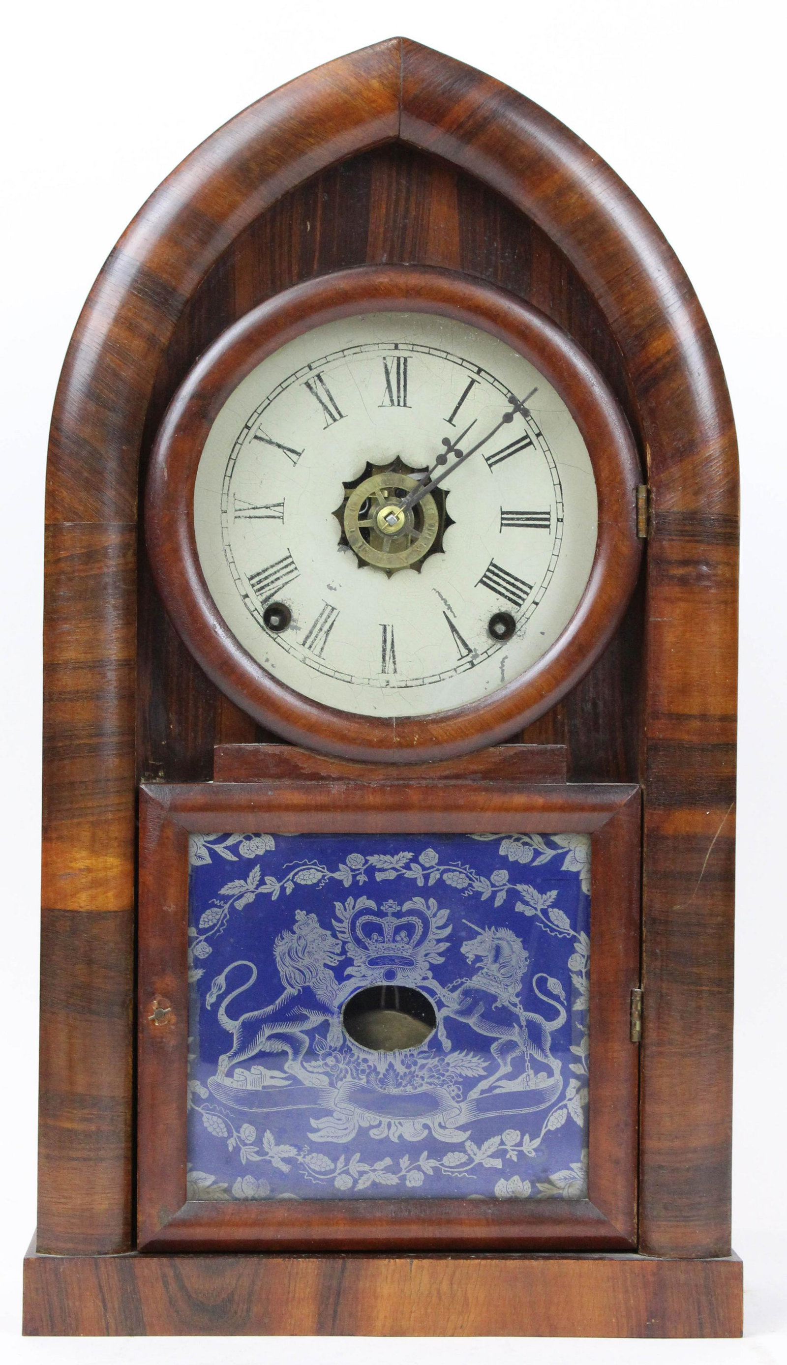 E N Welch Rosewood Beehive Shelf Clock: E N Welch rosewood veneered case shelf clock, eight day brass works, arched peak top, partial figure eight door, pendulum, key, good condition, ht 18 3/4"