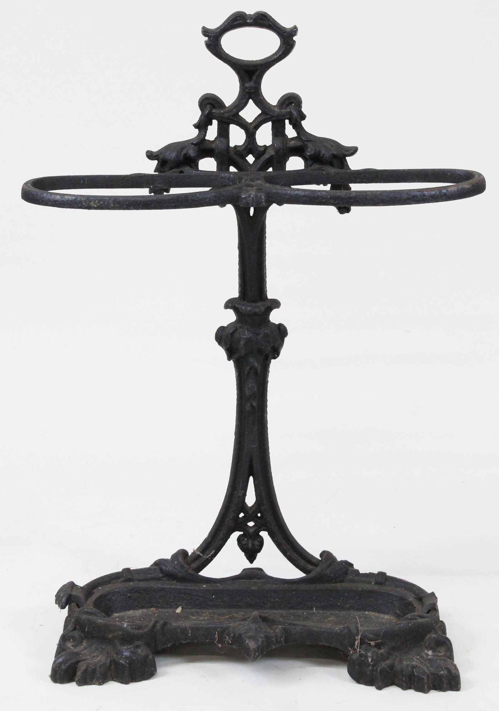 Cast Iron Umbrella and Cane Rack: Cast iron umbrella & cane rack, repainted oxidized surface, ht 29", missing bolt, zip tie used to connect sections