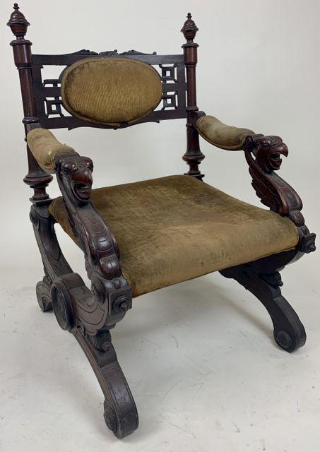 Fine Victorian walnut bird carved arm chair.: Ca. 1870 Victorian walnut armchair. Open mouth bird's head carved arms, rolled feet, appears to have original covering. Family history of chair being originally owned by Samuel Clemens (Mark Twain).
