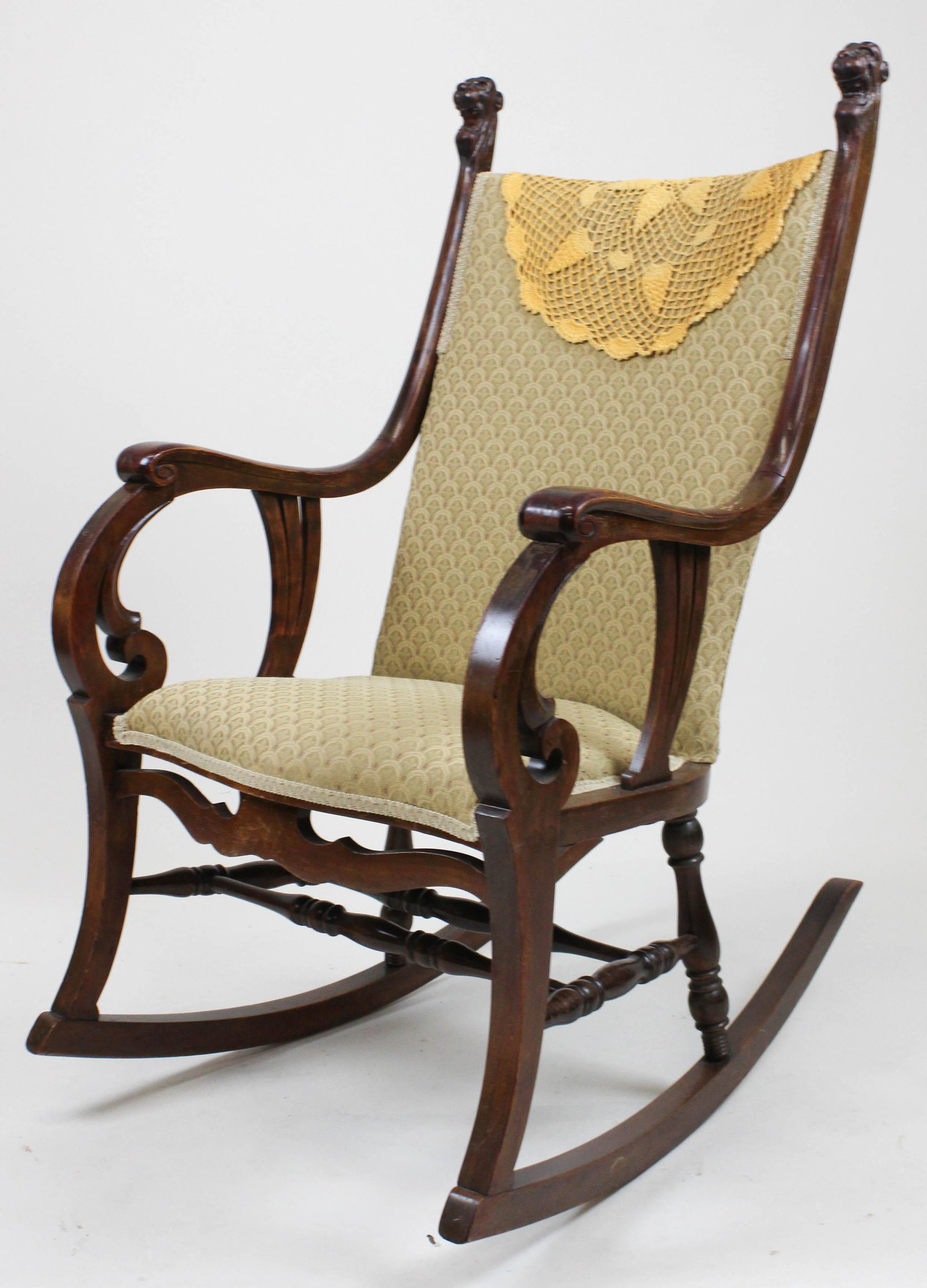 Victorian lion head carved rocking chair: Late 19th c stained birch rocker with carved lion heads. Recovered.