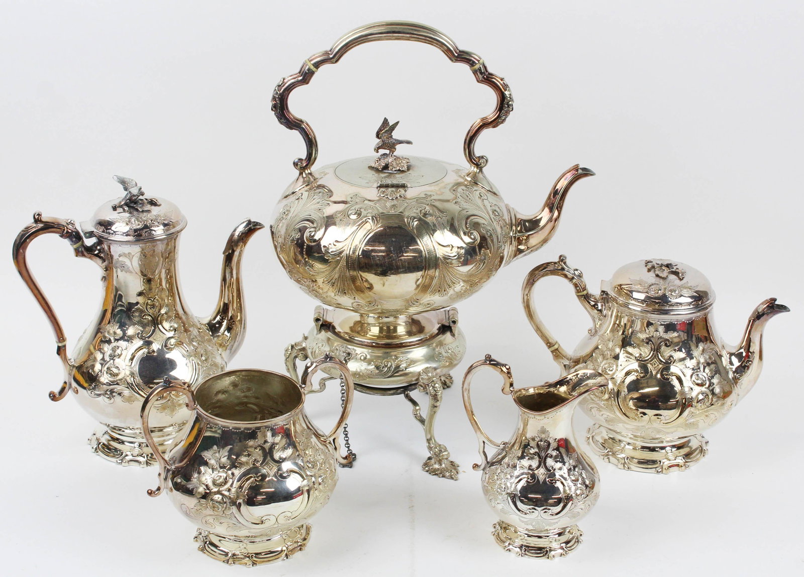 Sheffield Silver Plated Rococo Tea Service: Ca. 1860 Frederick Ellis Timm & Co. Sheffield Silver Plated Victorian Rococo Style Tea Service consisting of hot water kettle on stand, coffee pot, tea pot, open sugar bowl, and creamer, all having fl