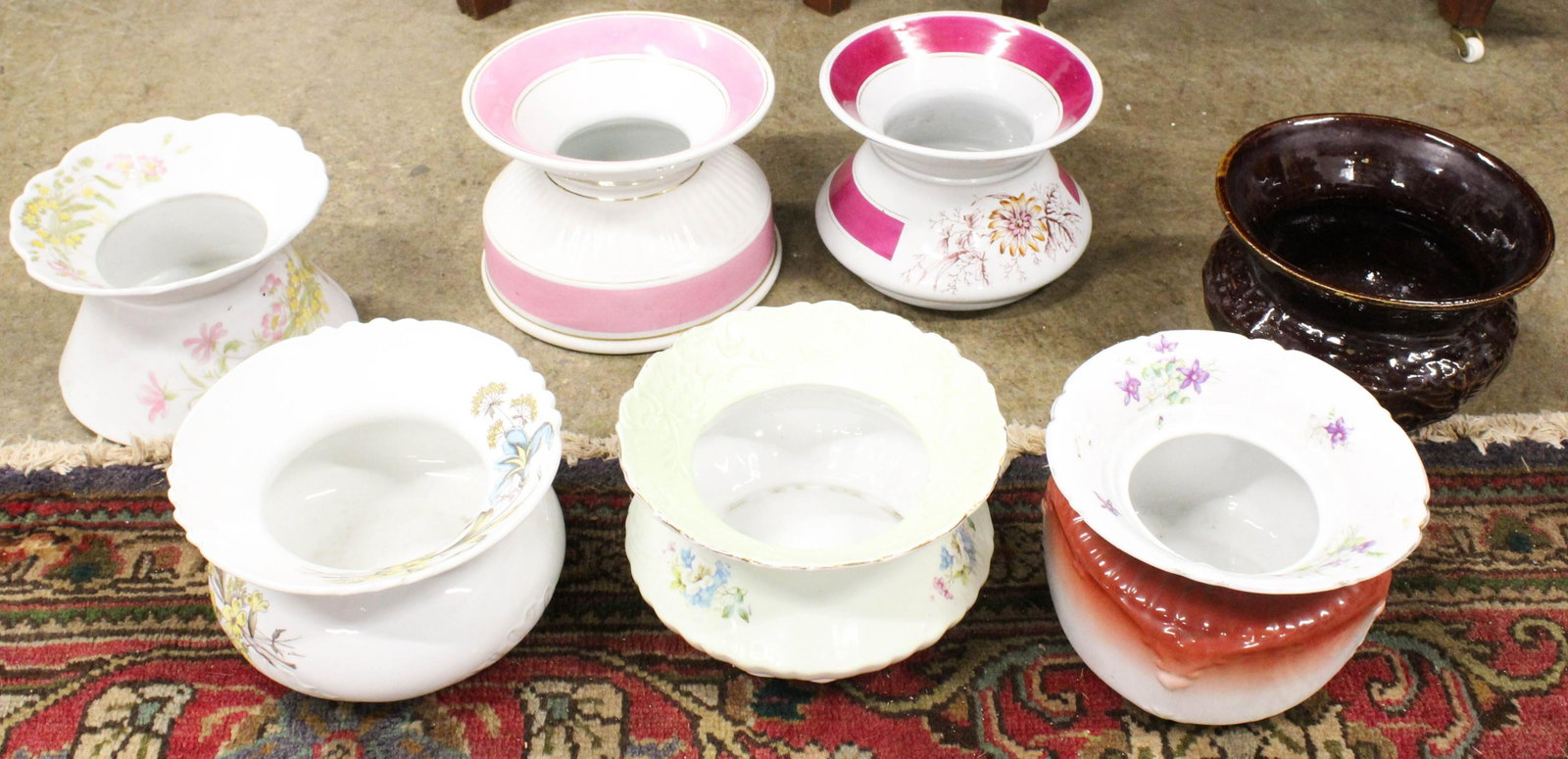 Collection of 7 Victorian Porcelain Spittoons: Unusual collection of 7 turn of the century Victorian porcelain ladies spittoons or cuspidors including pink banded, floral decorated, brown glazed, etc.
