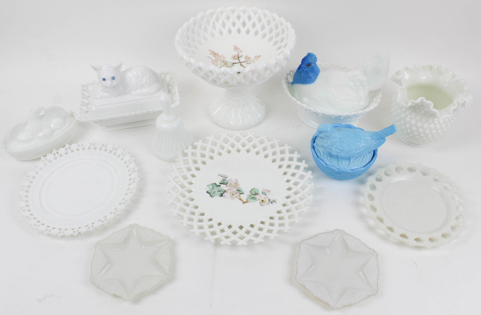 12 pcs. Victorian Milk Glass Items incl. Atterbury: 12 pcs. Victorian Milk Glass Items including Atterbury type hen on nest, cat on nest dish with lace edge, 3 lattice edge plates and compote (compote has repaired base), "American Hen" on nest Spanish