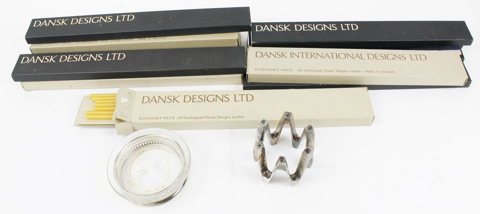 Dansk Candle Holder, Candles, Wine Coaster: Dansk Designs France silver plated "Crown" candle holder and 10 boxes of Dansk long taper candles (some partials), ht 3", sold with a sterling base cut glass wine coaster