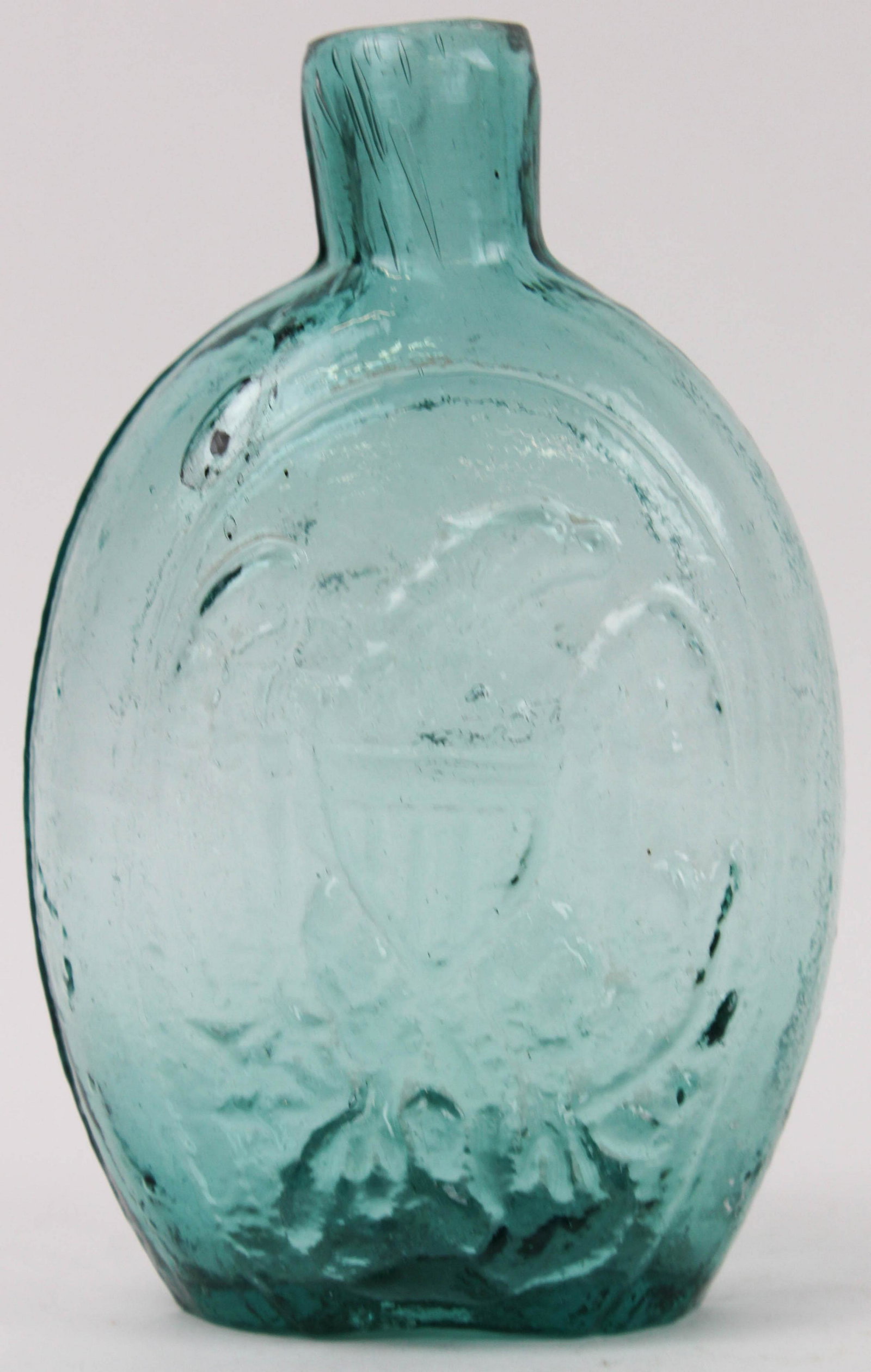 American Eagle/Cornucopia Historical Flask: American Eagle/Cornucopia one pint historical flask, deep aqua blue glass, open pontil, charcoal inclusions, thick heavy flask, ht 7", small spider crack on side edge ridge