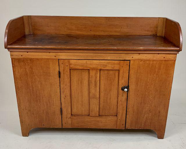 19th c country pine dry sink: 19th c pumpkin pine dry sink or sorting cabinet. Shaped base, single door, splashtop. 48" long, 36" high, 18" deep.