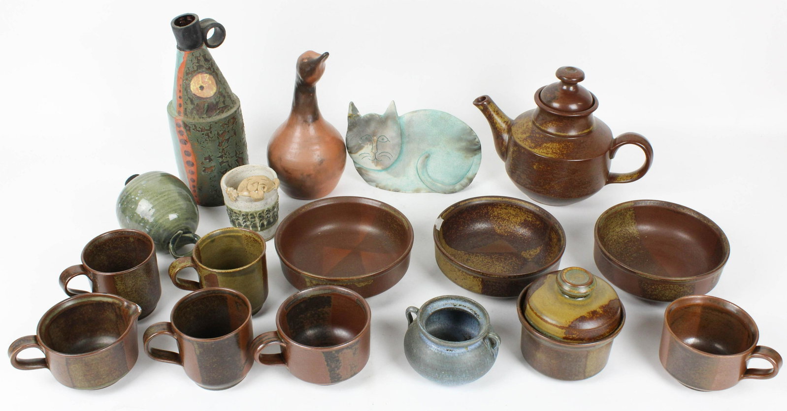 Iron Mountain Stoneware and other Studio Pottery: Lot of Iron Mountain stoneware Laurel Bloomery, TN "Roan Mountain" pattern dinnerware and other studio pottery, some items with chips, damage or repairs