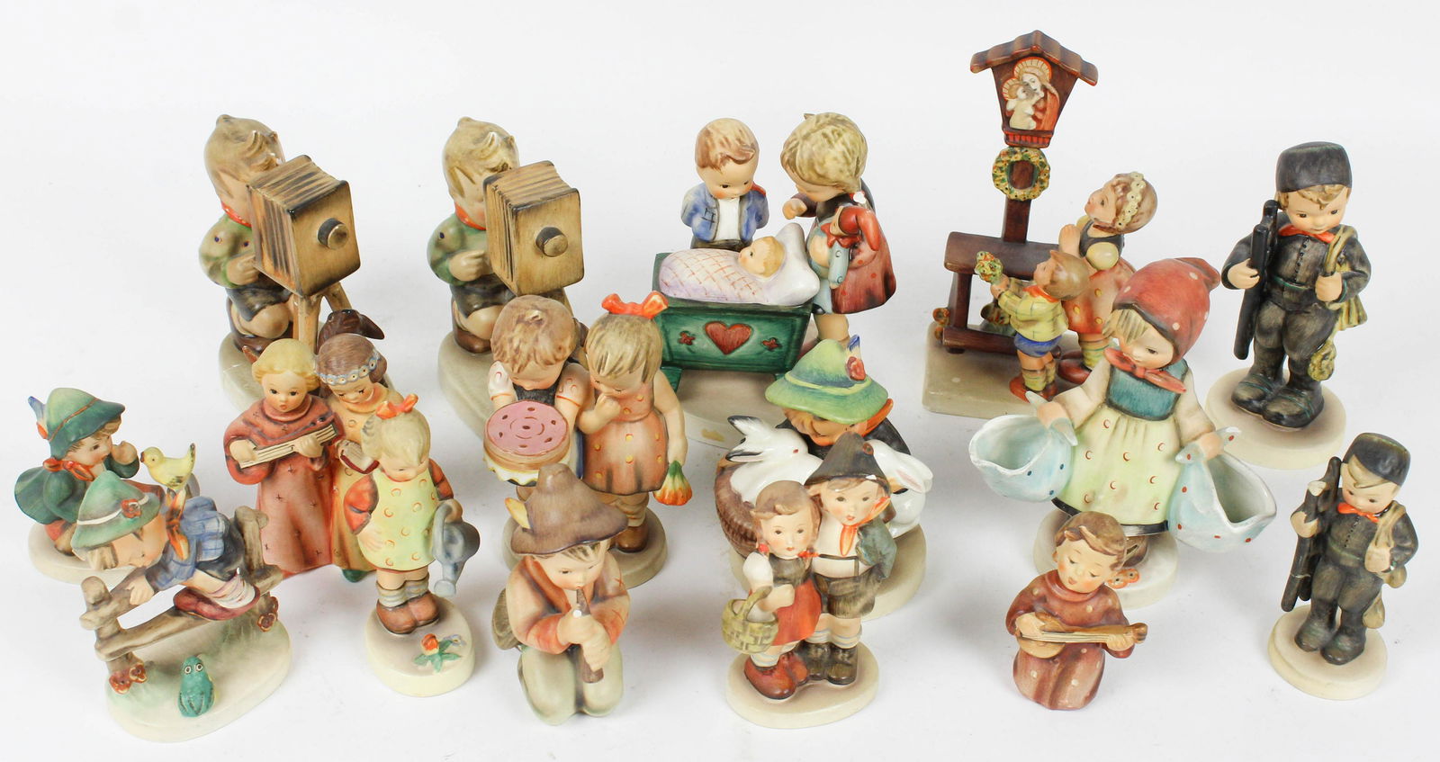 Collection of 16 Goebel Hummel Figurines: Collection of 16 Goebel Hummel Figurines with various marks -some with damage and repairs ht. 3"-7"