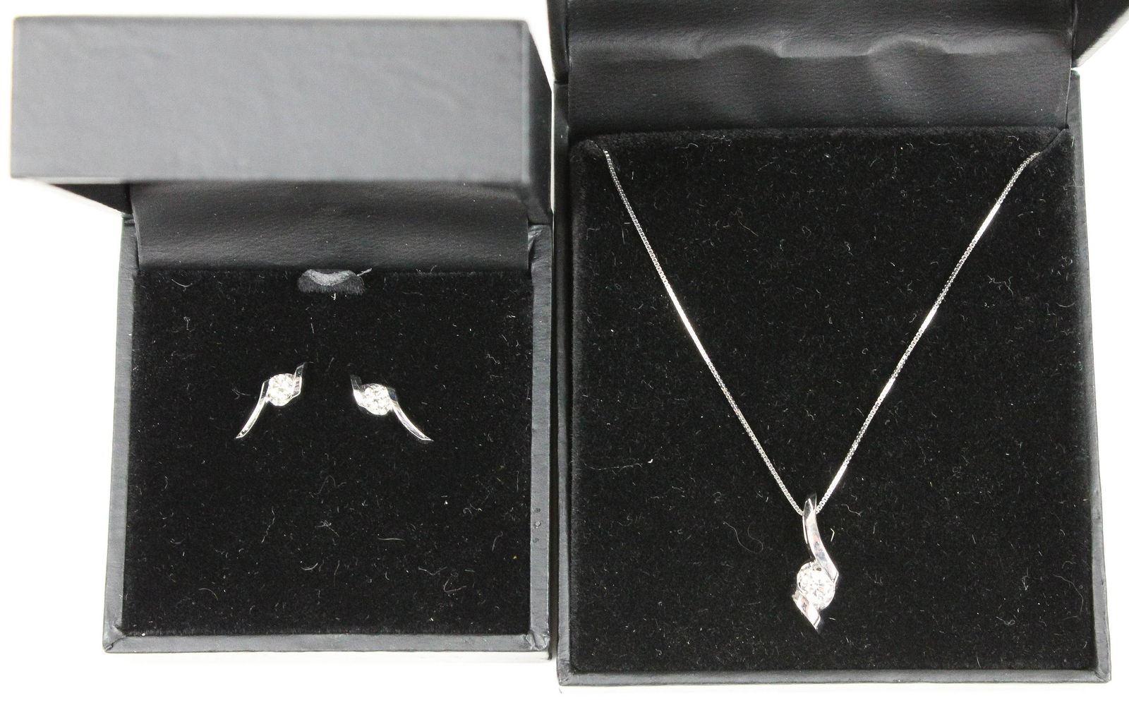 14k w.g diamond pendant & earring set.: 14k white gold set including a diamond 1/4 round cut pendant and pair of 14k w.g. diamond earrings with .1 ct diamonds.