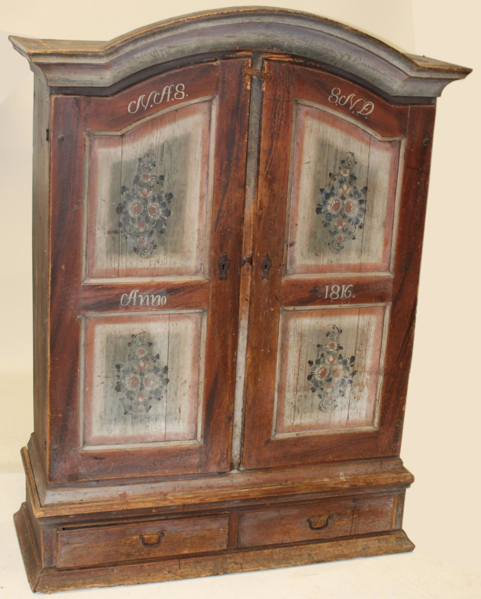 19th c Scandinavian paint decorated Kas: Early 19th c Scandinavian paint decorated two door Kas or armoire. Arched top over two doors, over drawer. 49" wide 75" high.