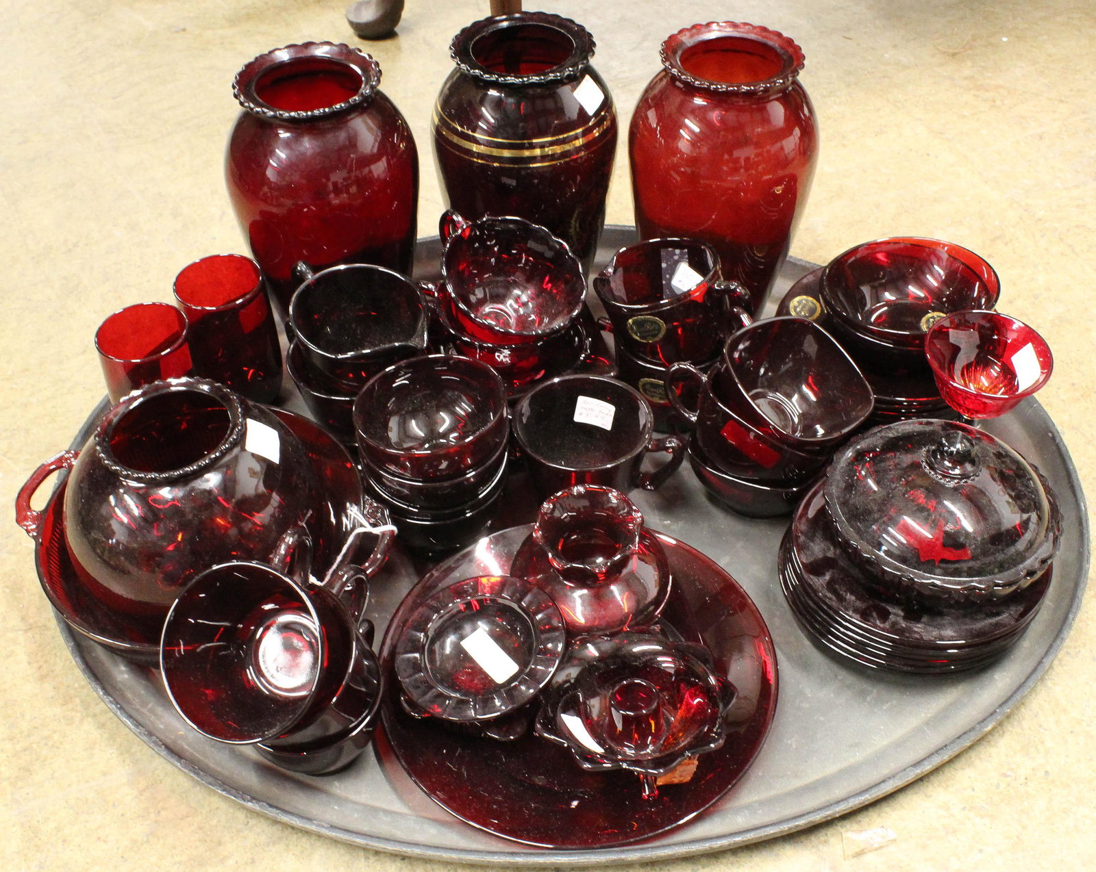 53 pcs. Royal Ruby Red Glass Tableware: 53 pcs. Royal Ruby Red glass tableware, many pieces with original labels, includes vases, plates, cups and saucers, candlesticks, etc.