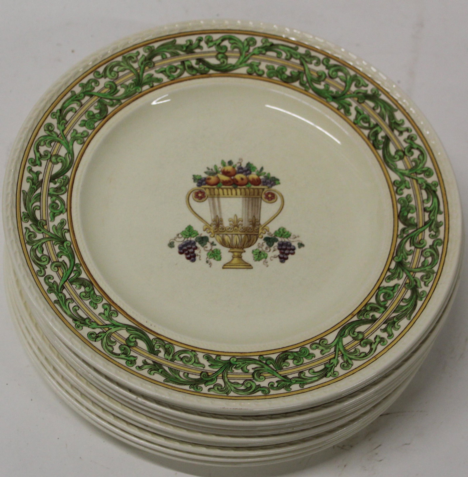 Early 20th c. Guilloche enamel pill box with: Set of 11 Wedgwood English porcelain dinner plates with Italian renaissance style green scrolling border surrounding large urn filled with fruit 10.75" dia.