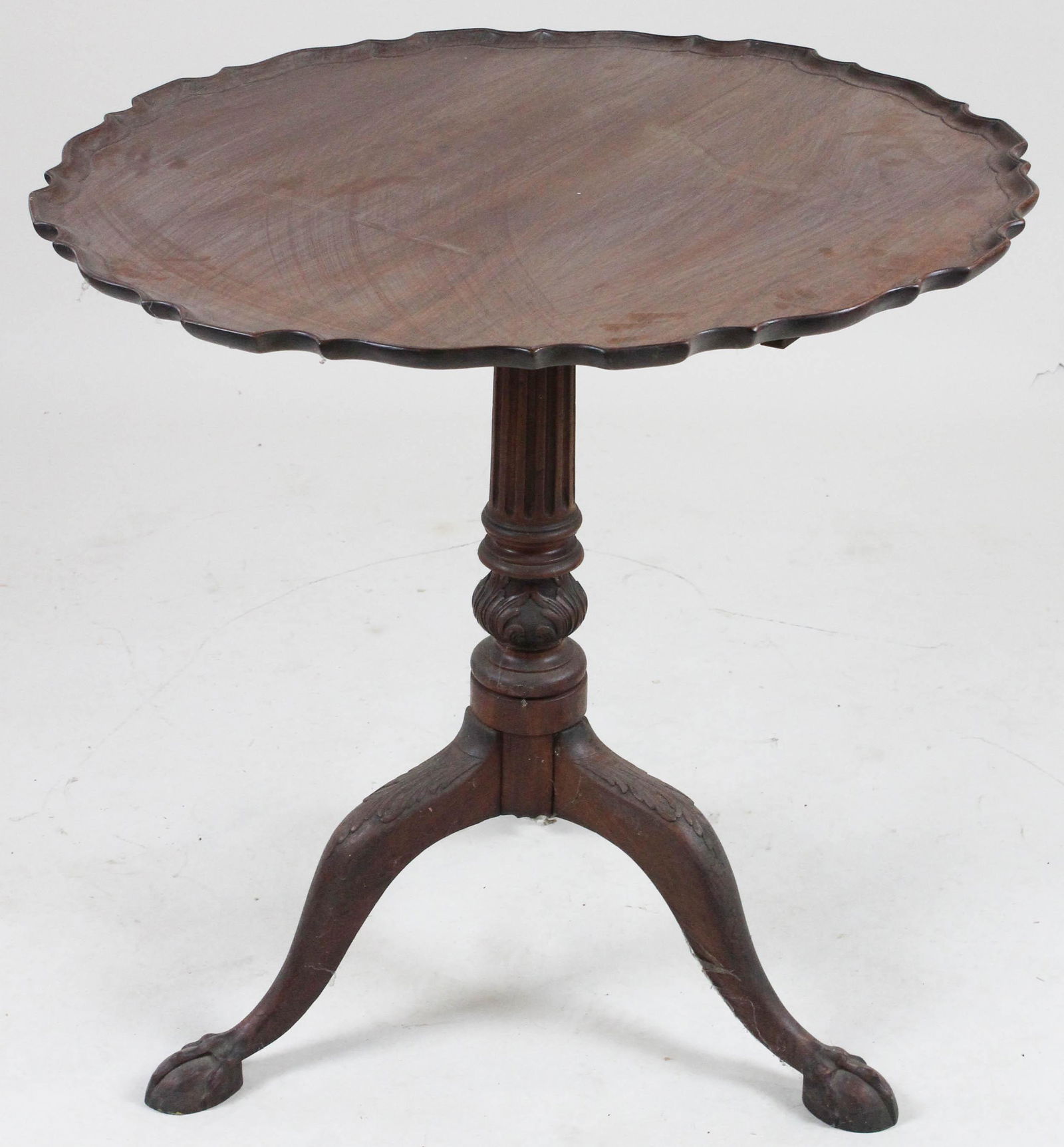 Centennial Chippendale mahogany tilt top tea table: Centennial Chippendale mahogany tilt top tea table. Pie crust top, acanthus carved column & knees, ball and claw foot. 30" diameter