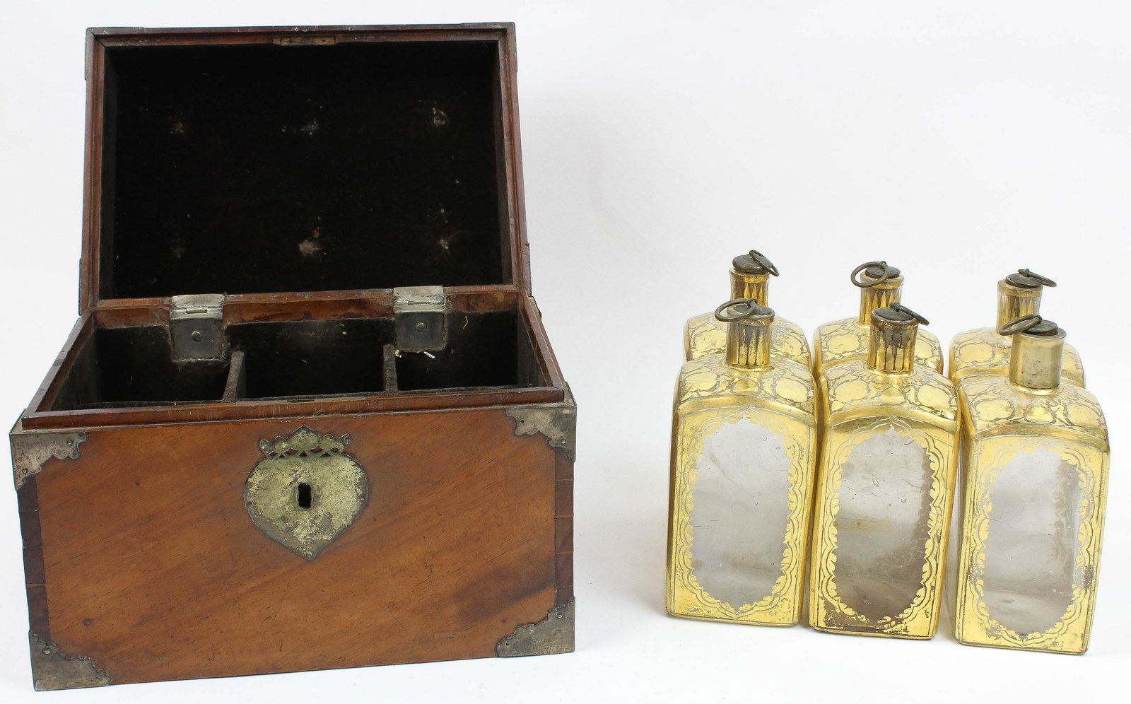 Early 19th c Dutch Cased Decanter Set: Early 19th c Dutch cased liquor decanter set having six blown, cut, & polished gilt bottles, hts 6 3/4", in a dovetailed mahogany case with silvergilt hardware, bearing the label of A J Spijer & Zoon,