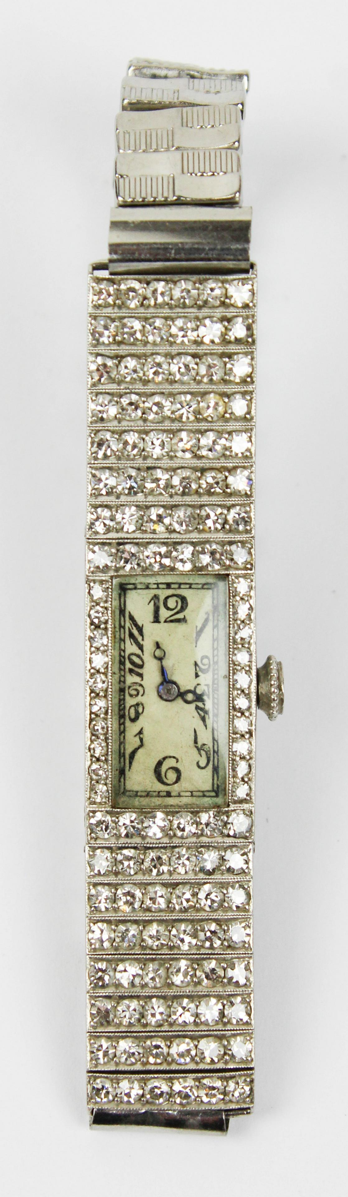 C H Meylan Swiss Art Deco platinum & diamond watch: C H Meylan Swiss Art Deco platinum and diamond tank style ladies wrist watch. Rectangular style face with 10 diamonds on each side .01 ct round cuts, top and bottom with 6 round cut diamonds .02 ct ea